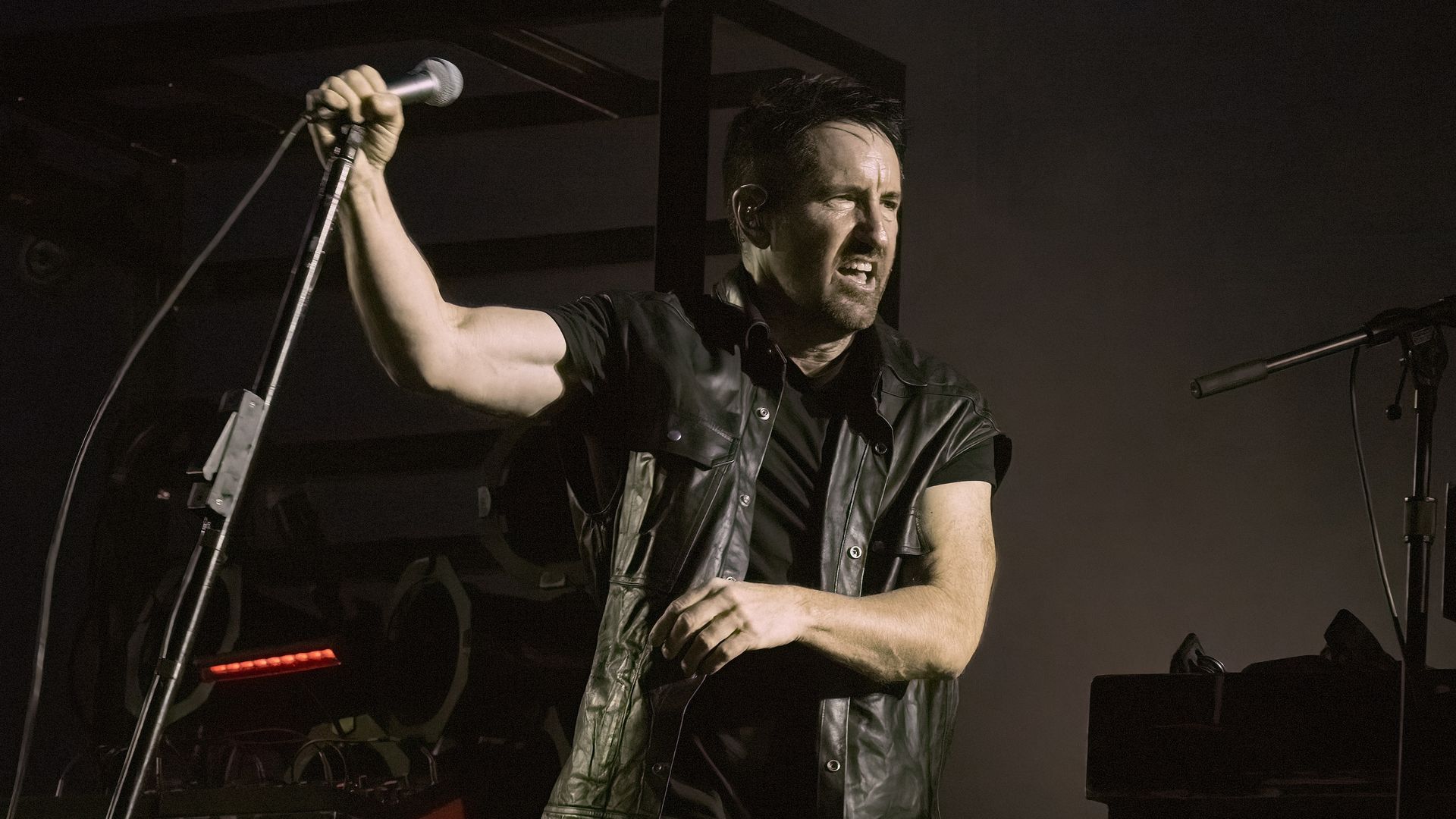 Trent Reznor of Nine Inch Nails performs on stage. 