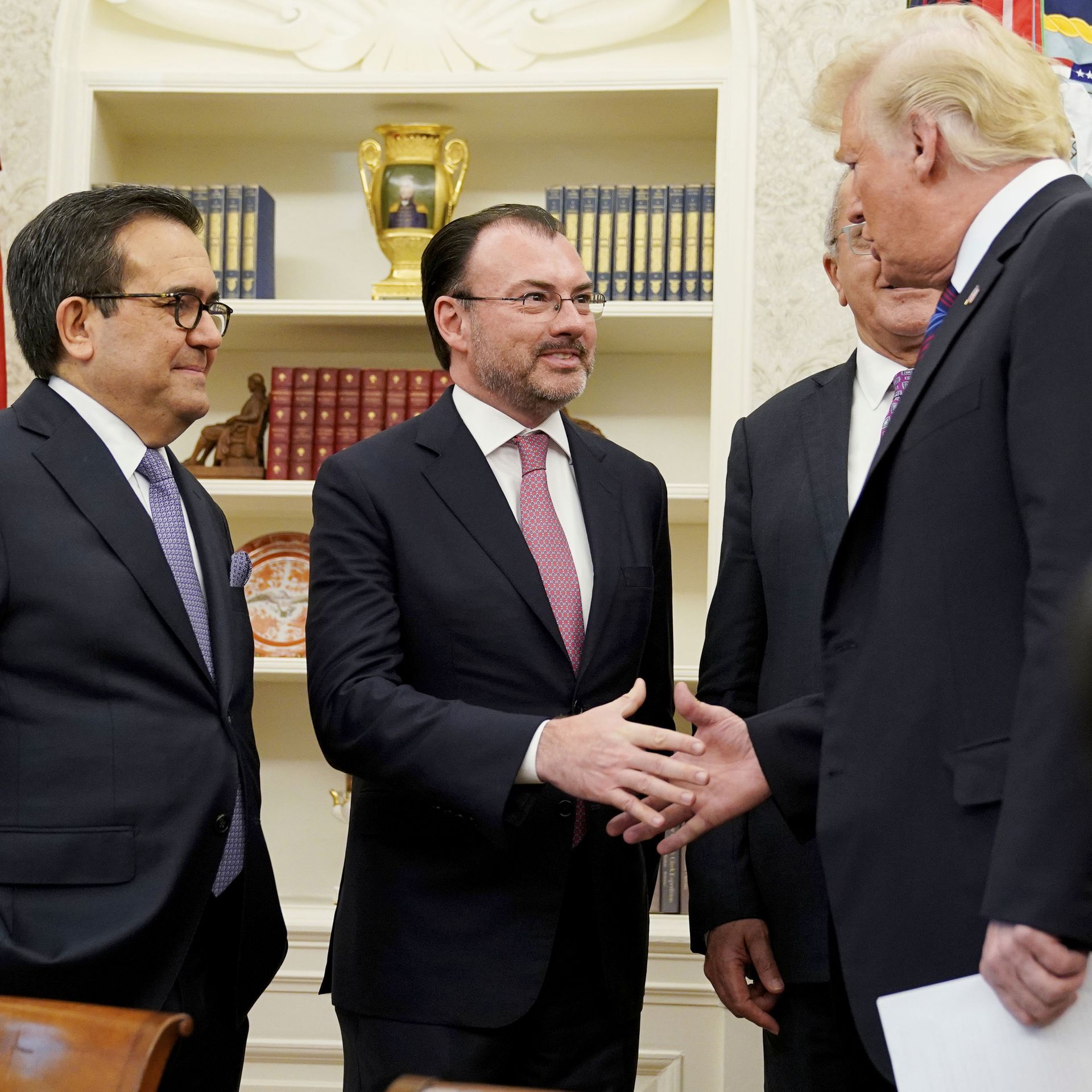 US President Donald Trump shakes hands with Mexico's Foreign Minister Luis Videgaray Caso as he arrives to speak on trade in the Oval Office.