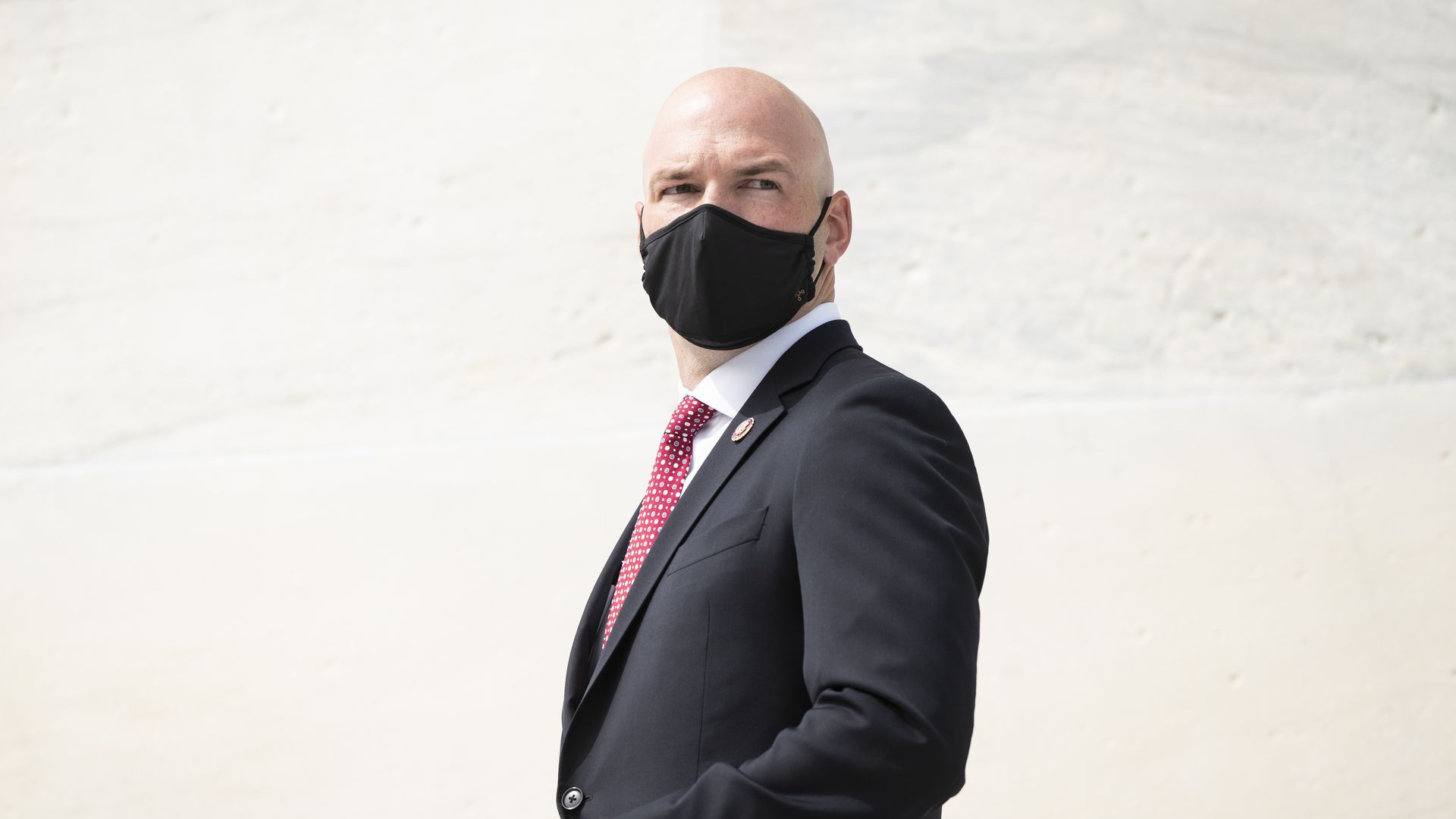 Photo of Anthony Gonzalez wearing a mask and looking behind his shoulder