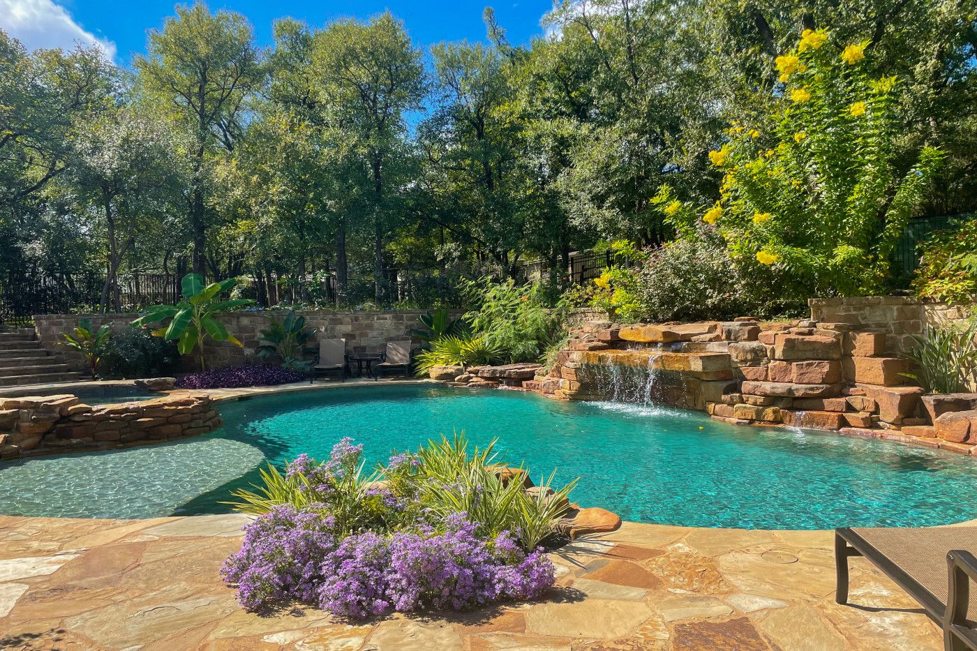 backyard pool with waterfall