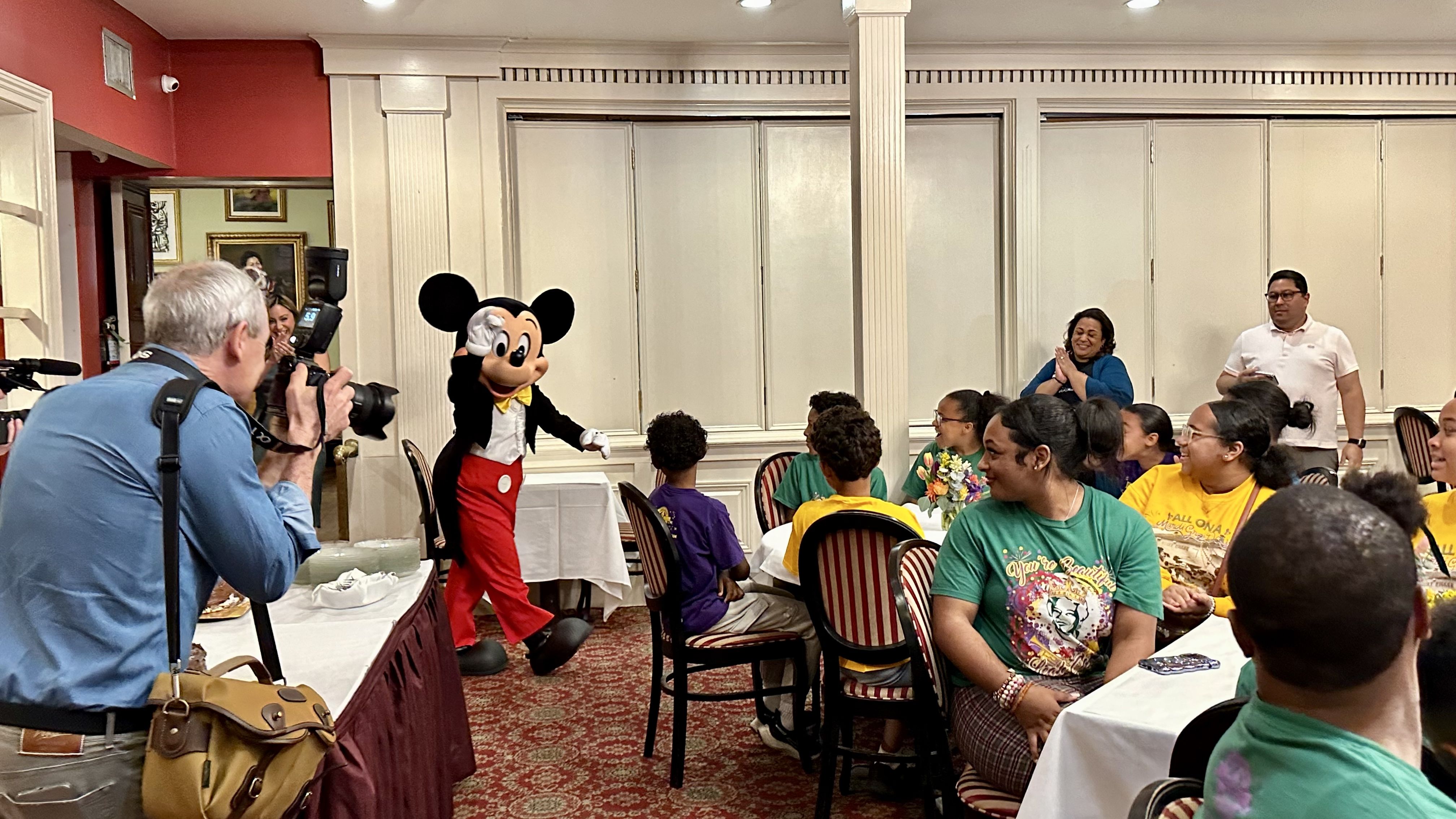 Photo shows Mickey Mouse walking into Dooky Chase.