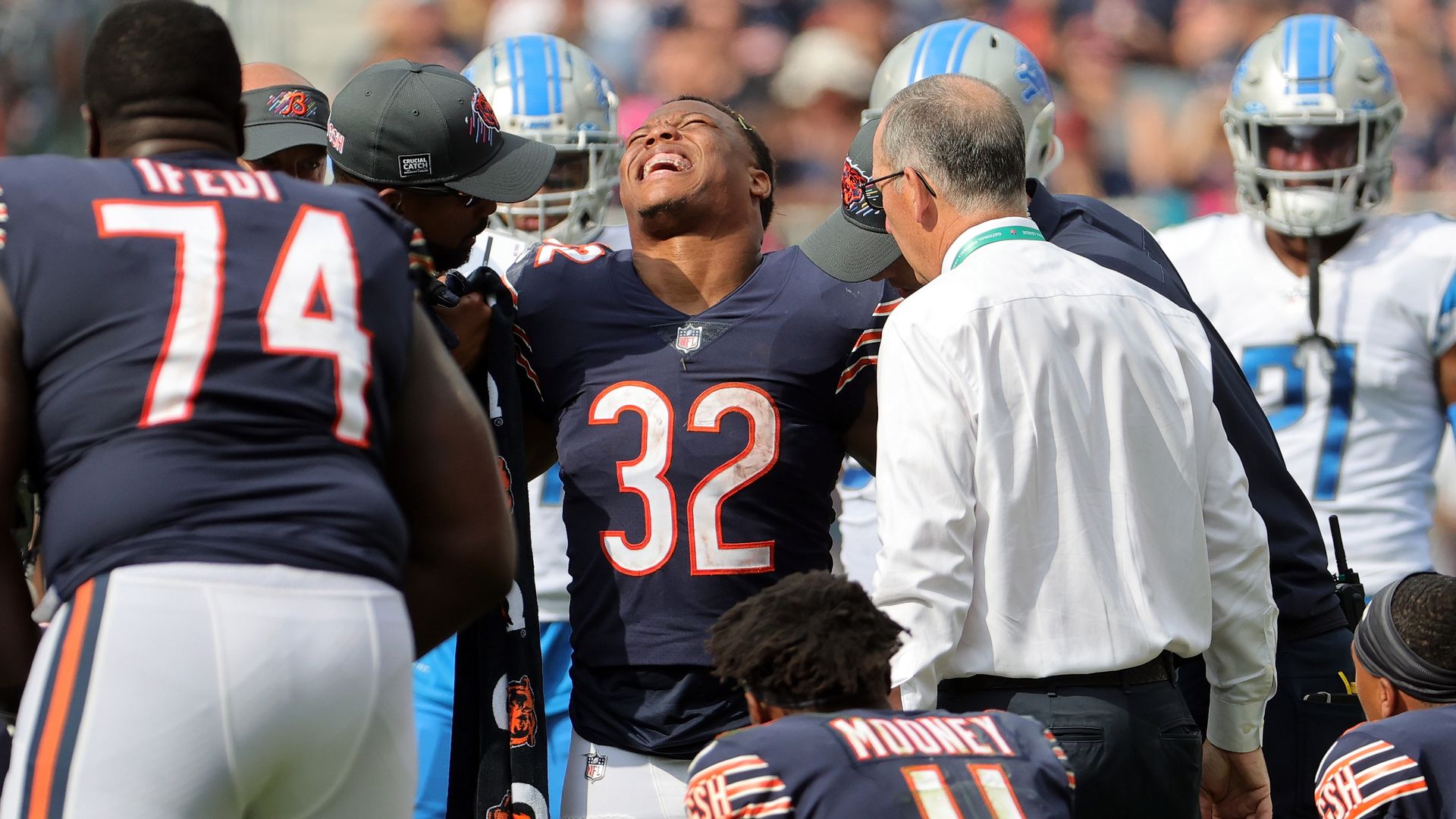 David Montgomery grimaces after knee injury. 