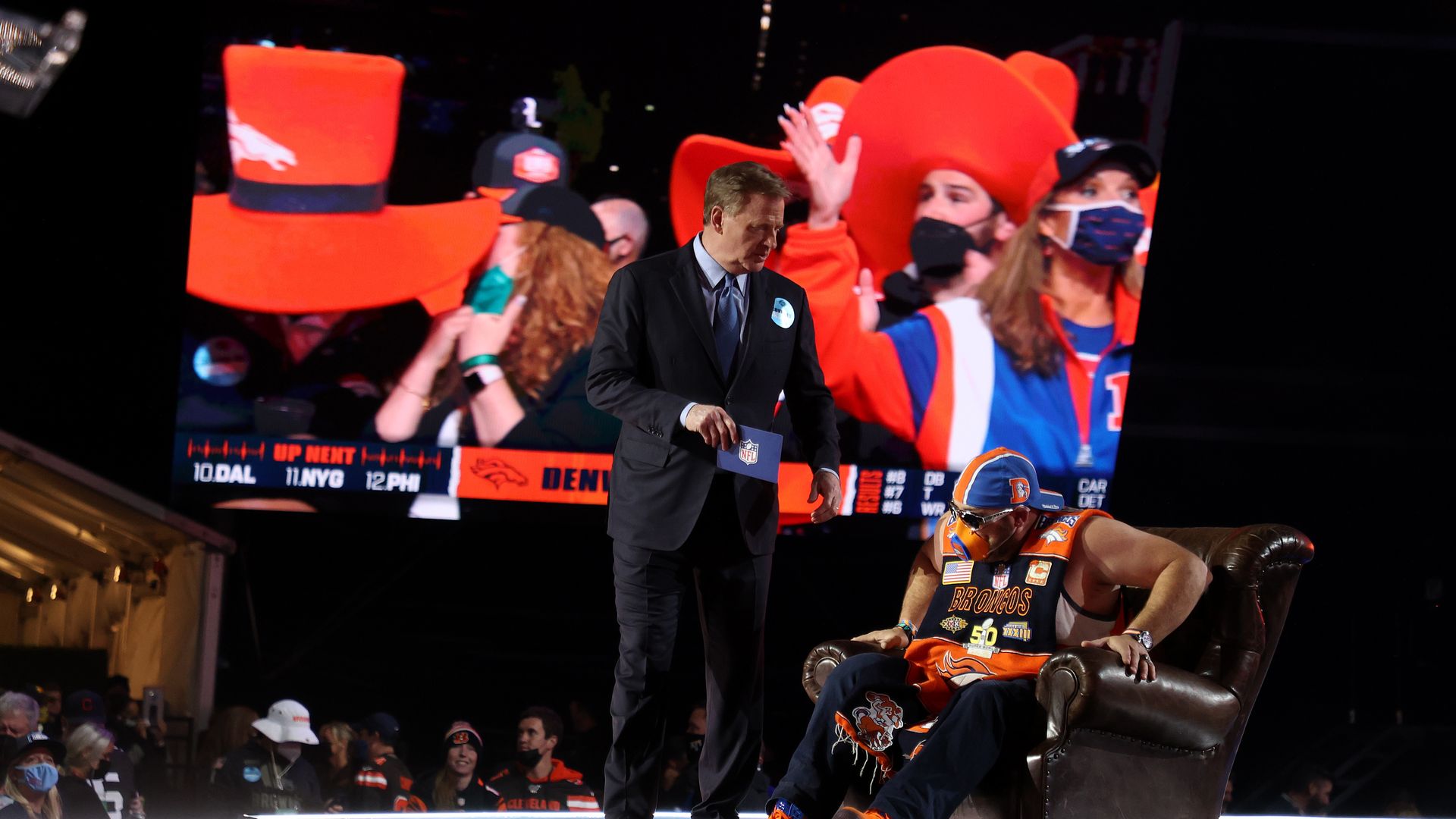 A Denver Broncos fan speaks with NFL Commissioner Roger Goodell onstage during round one of the 2021 NFL Draft at the Great Lakes Science Center on April 29.