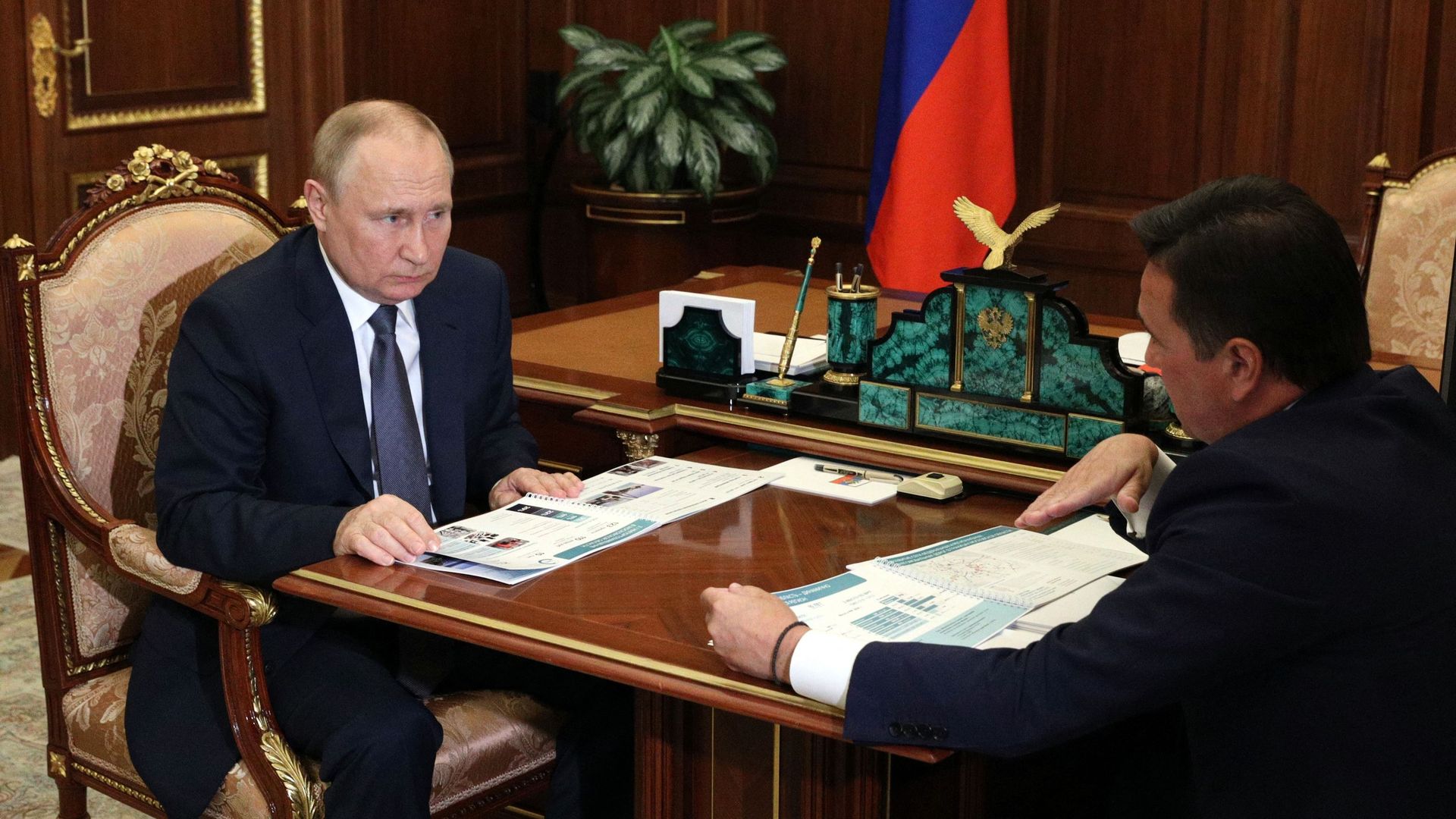 Vladimir Putin meets at the Kremlin yesterday with Andrei Vorobyov, governor of the Moscow region.