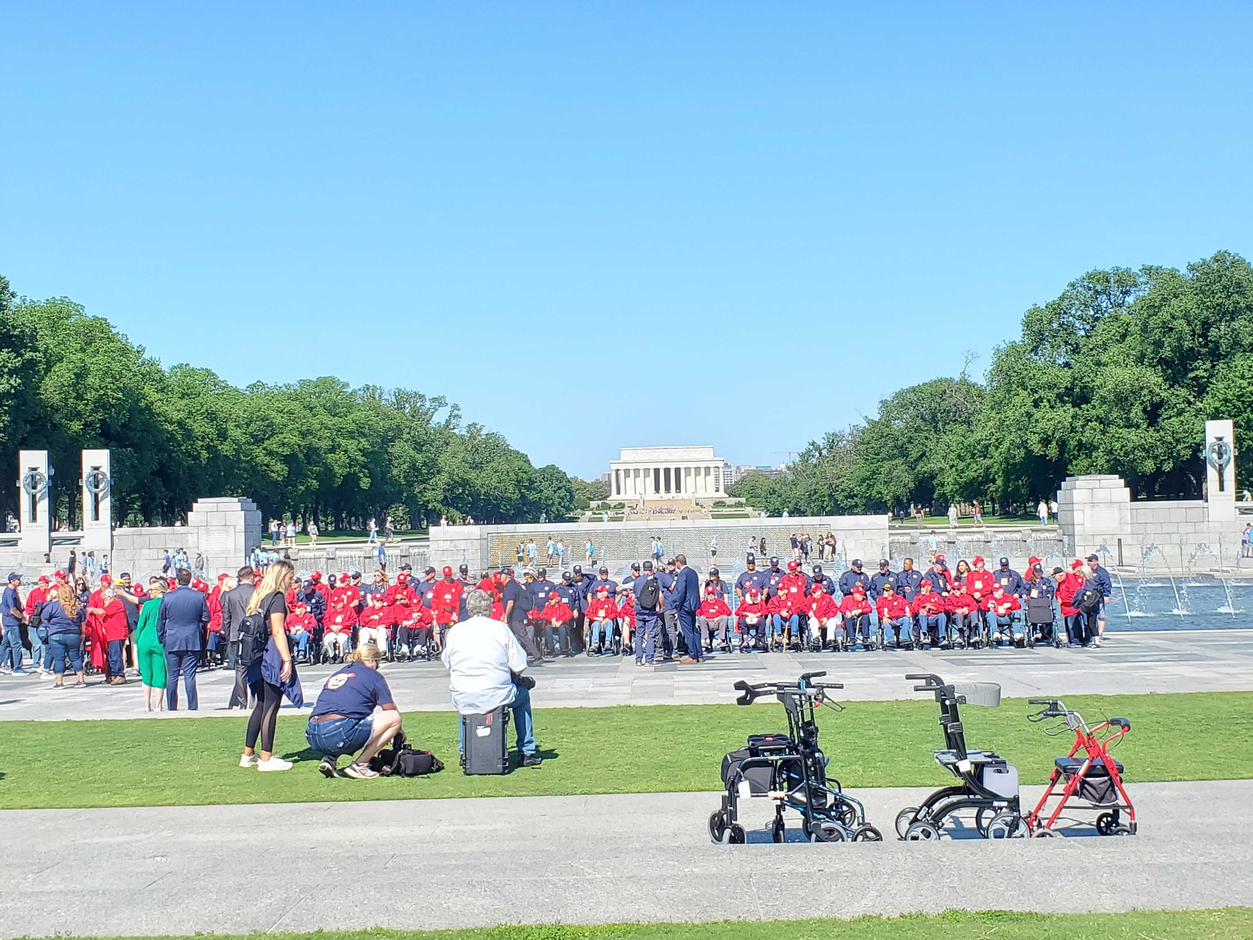 A group of veterans tour the World War II memorial.  