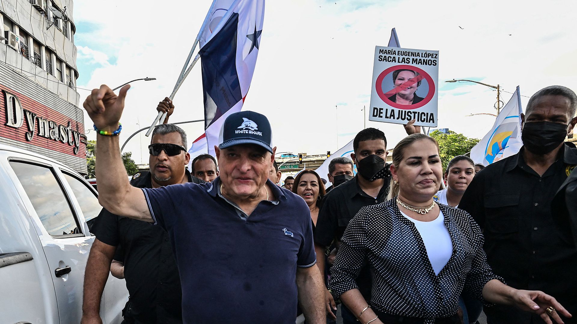 Former president of Panama Ricardo Martinelli raises his fist as he walks during a protest 