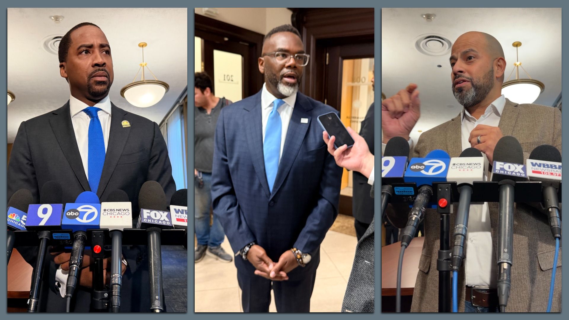 Three men in suits address reporters at a press conference: left in a dark suit with blue tie, middle in a navy suit with a light blue tie, right in a beige blazer; microphones show Chicago outlets.