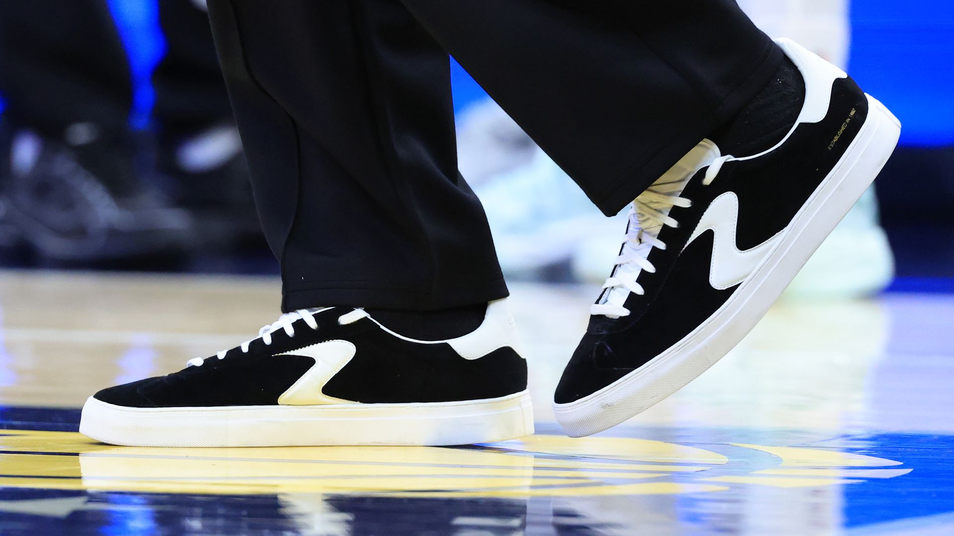 Sketchers shoes on a basketball court.