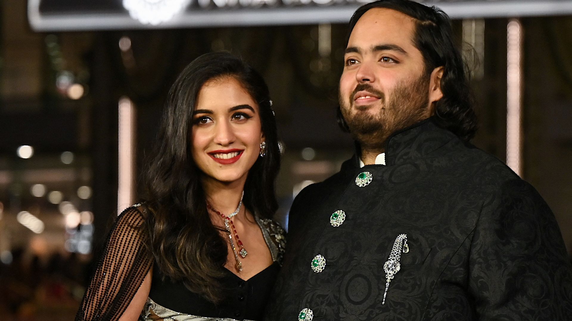 picture of a woman and man dressed in traditional Indian attire
