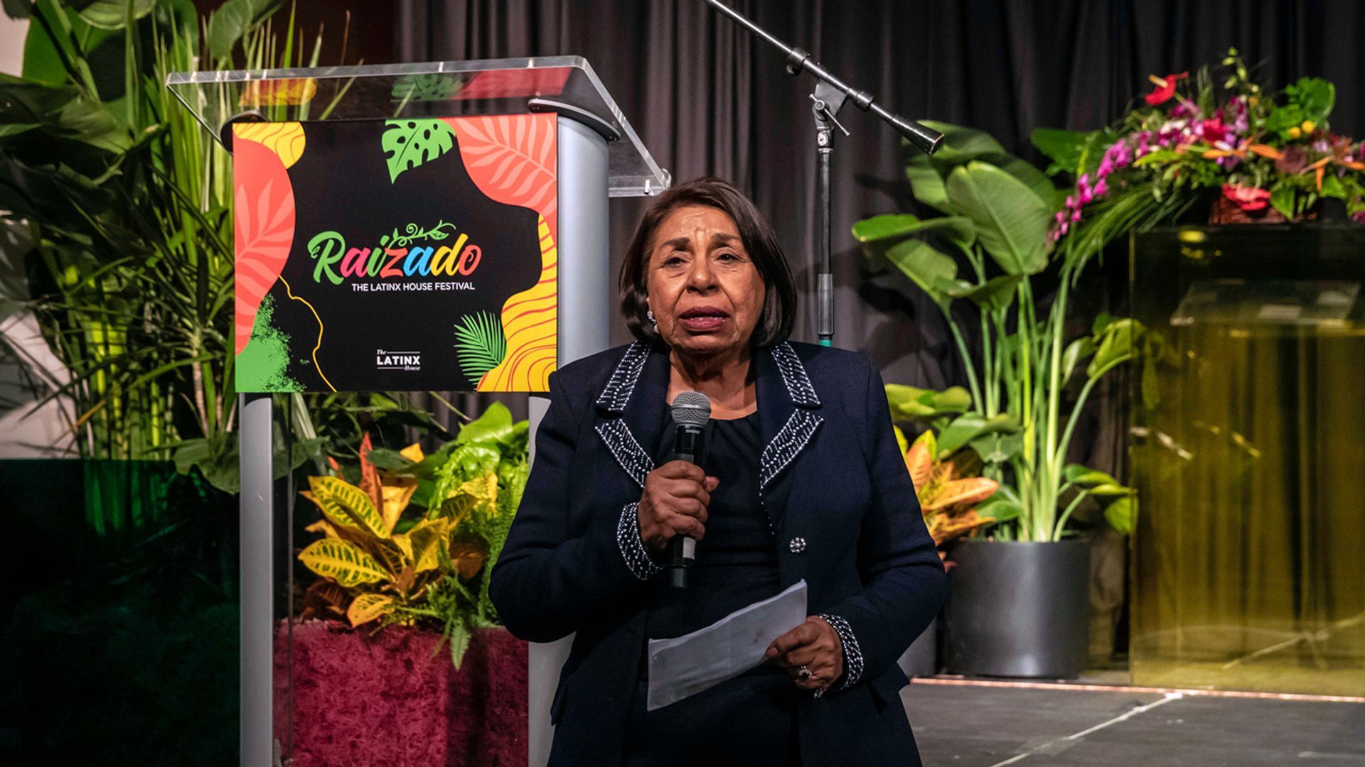 Sylvia Mendez speaks with a microphone after being honored at an event in Colorado