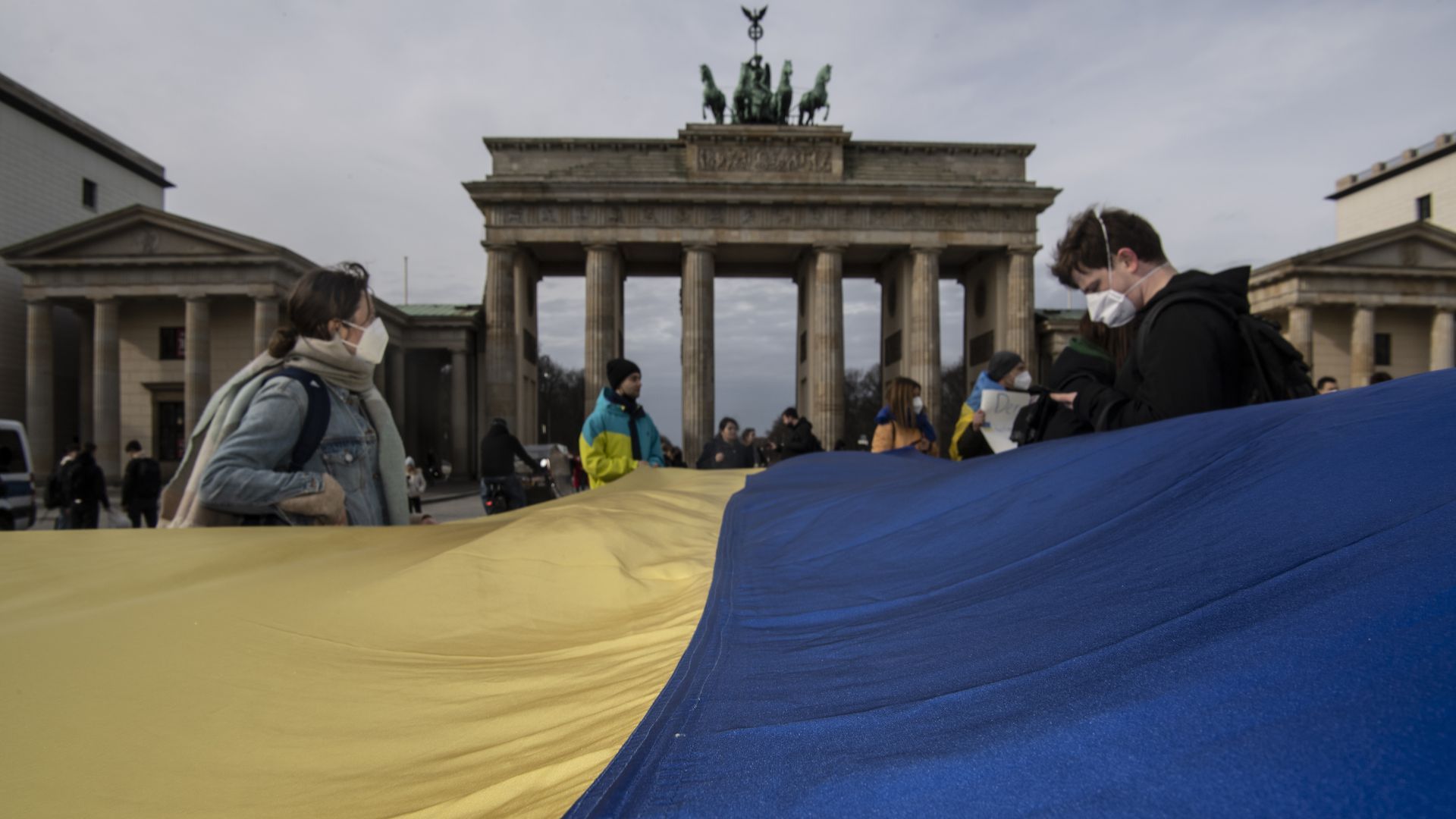 People holding Ukraine's flag in Berlin on Feb. 24. Photo: Paul Zinken/picture alliance via Getty Images