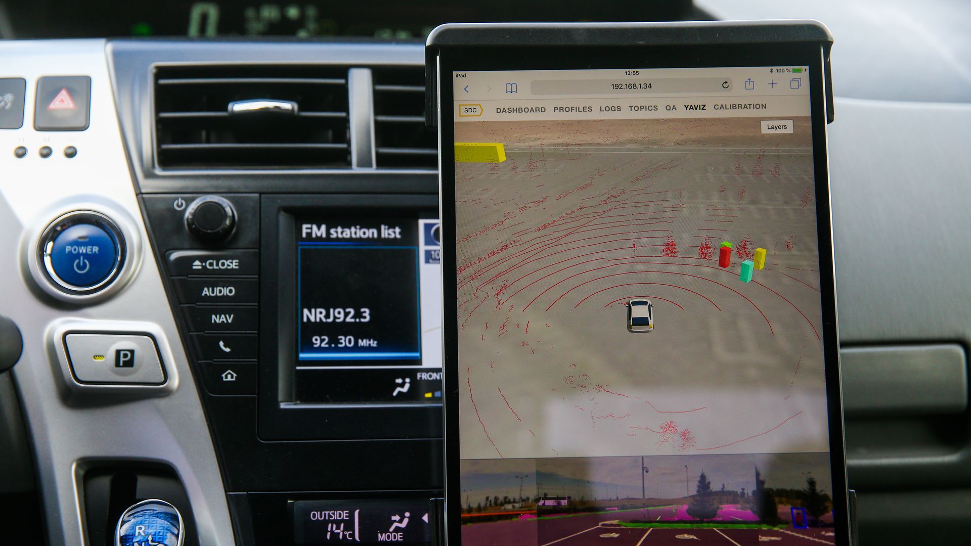 a tablet monitor set up on a car dashboard