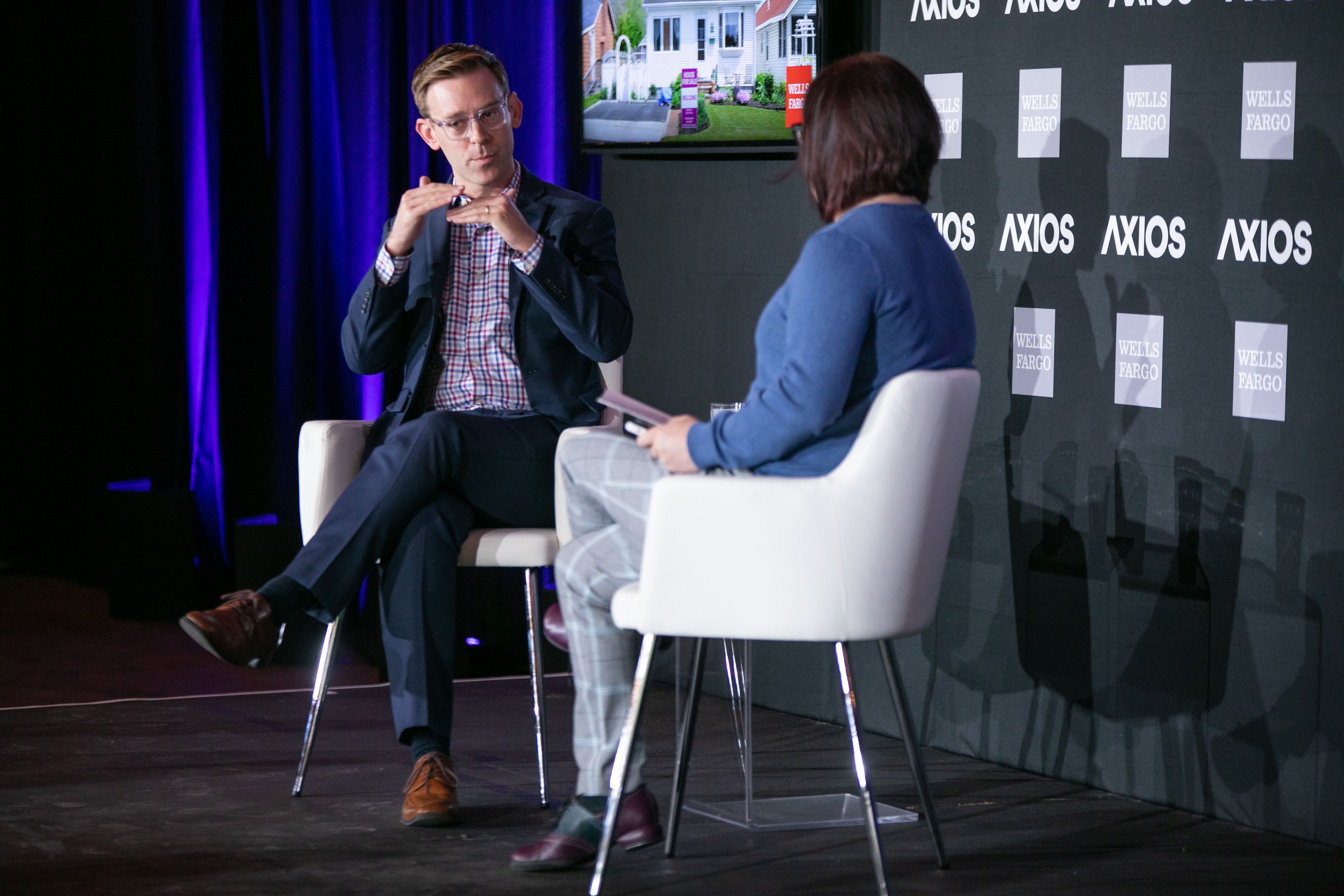 Ben J. Winter on stage with Axios' Ina Fried. 
