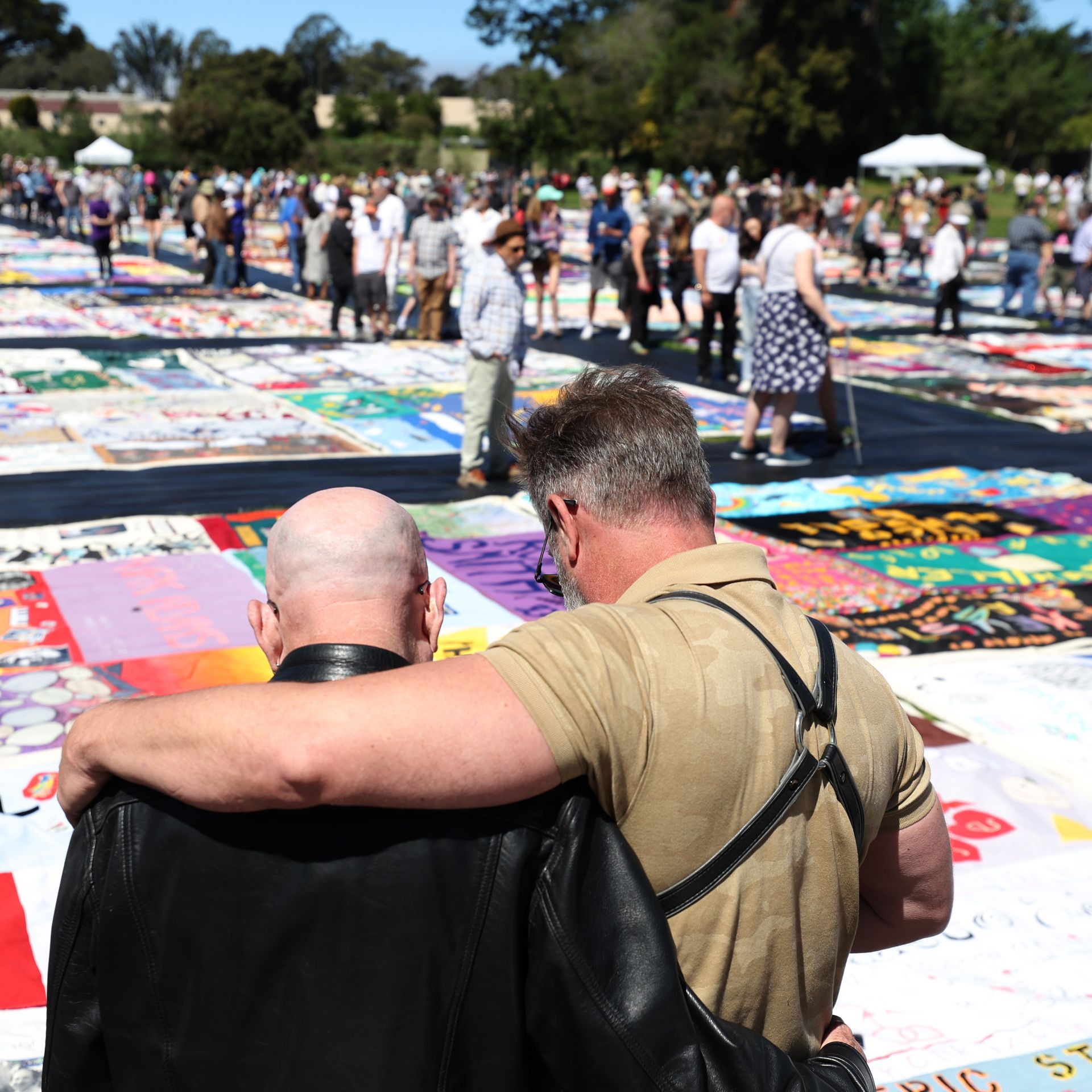 People at a quilt memorial display for people who died from AIDS in San Francisco in June 2022.