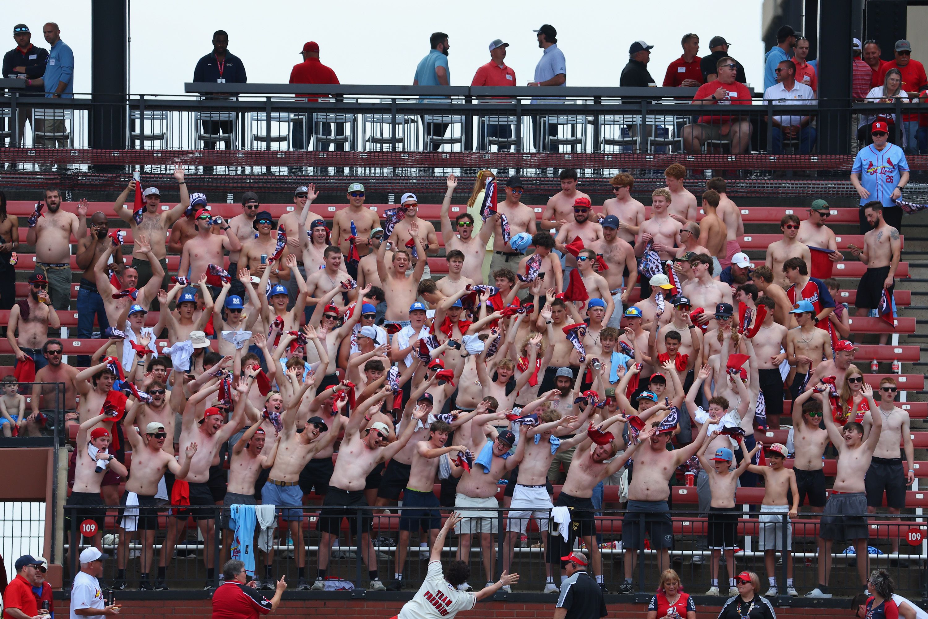 The "Tarps Off Crew" cheer on the St. Louis Cardinals on Thursday. Photo: Dilip Vishwanat/Getty Images