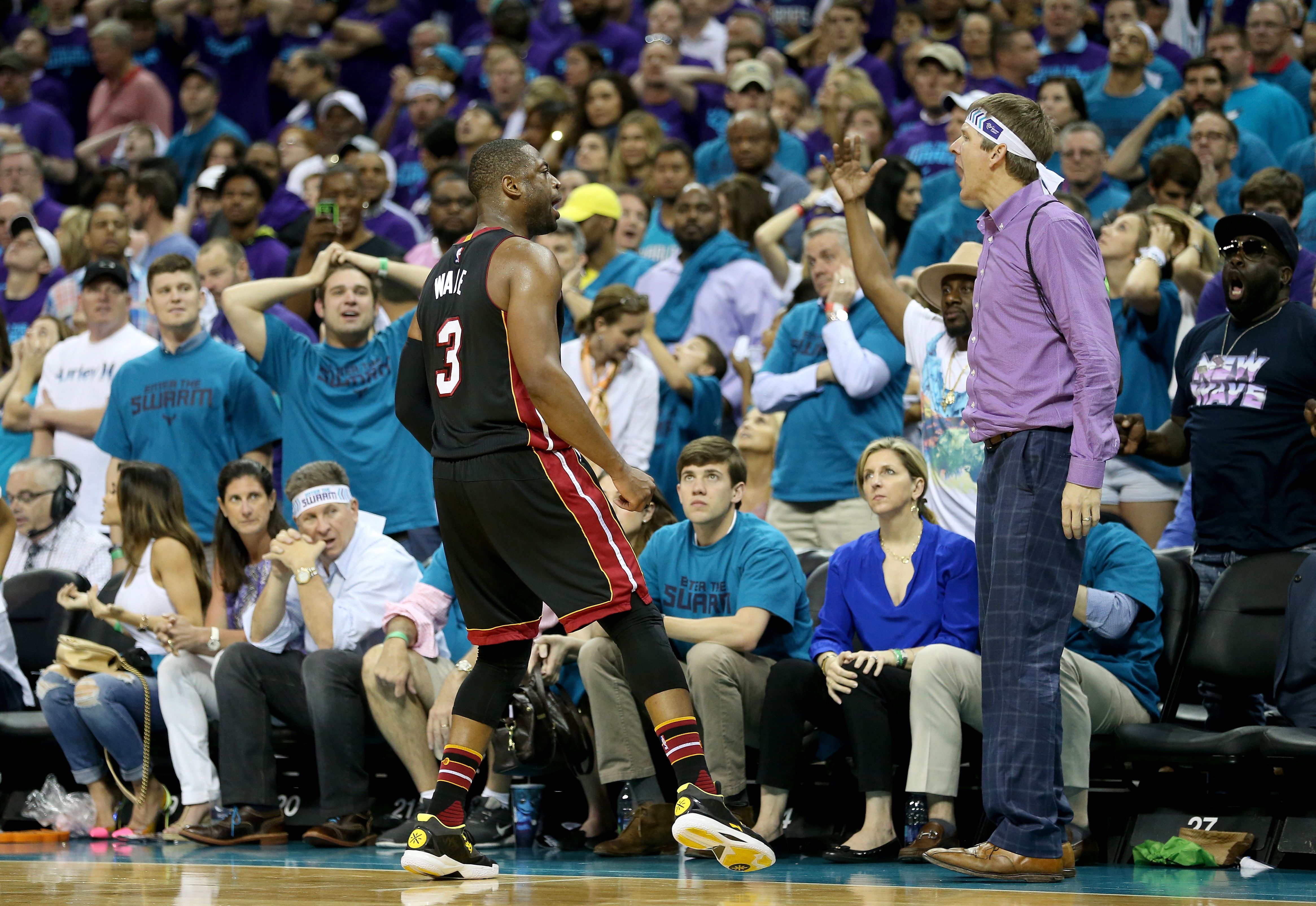 CHARLOTTE, NC - APRIL 29: Dwyane Wade #3 of the Miami Heat reacts after making a shot late in the fourth quarter against the Charlotte Hornets during game six of the Eastern Conference Quarterfinals of the 2016 NBA Playoffs at Time Warner Cable Arena on April 29, 2016 in Charlotte, North Carolina. N