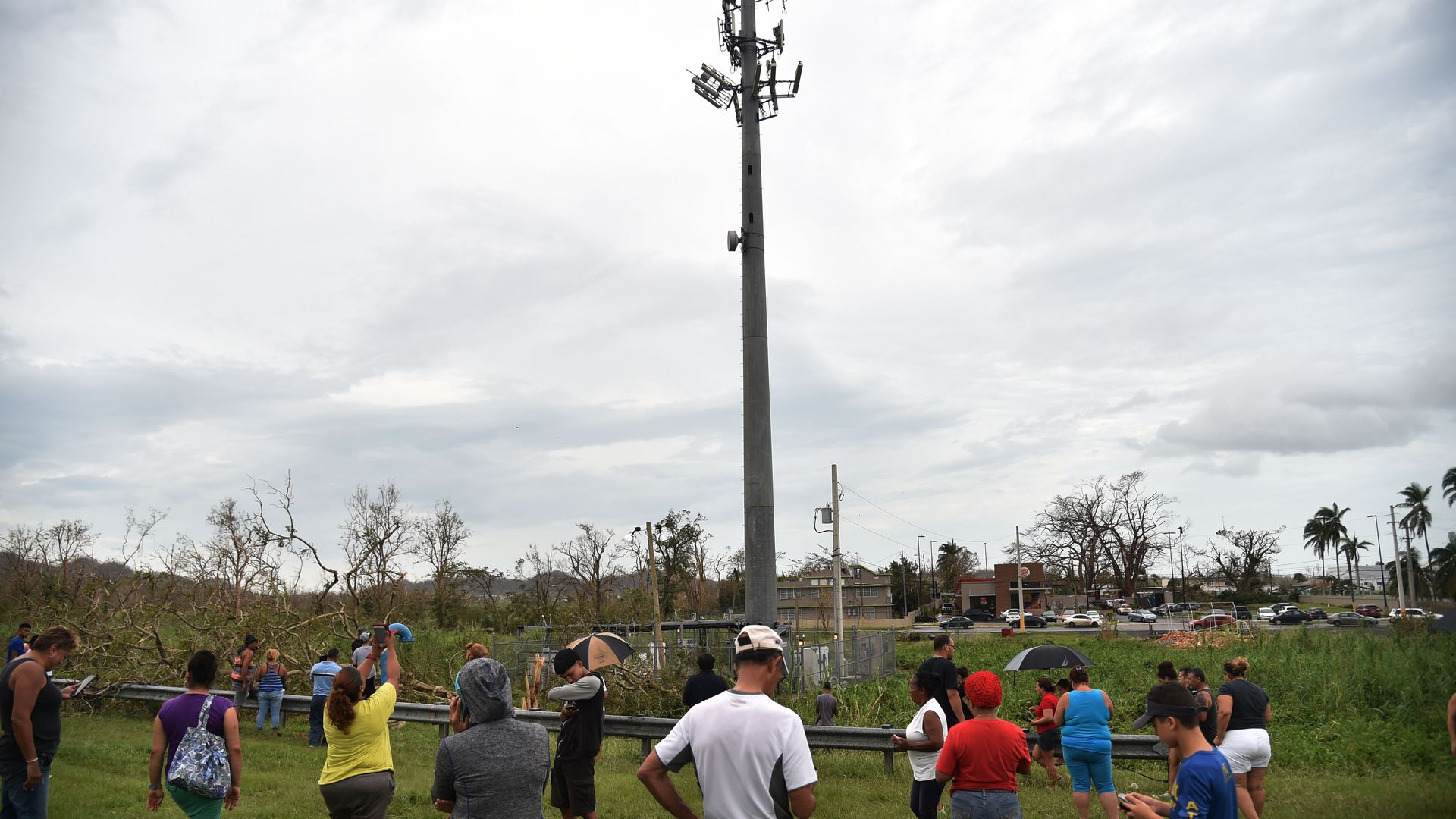 People try to get a cellphone signal in Puerto Rico after Hurricane Maria took down telecommunications networks