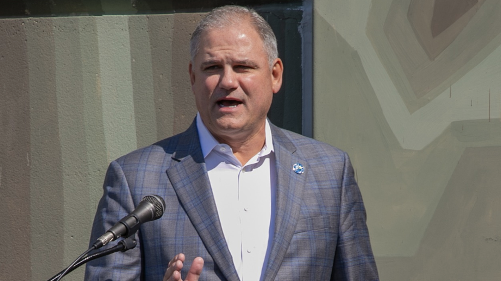 Frank Hibbard speaking at a podium