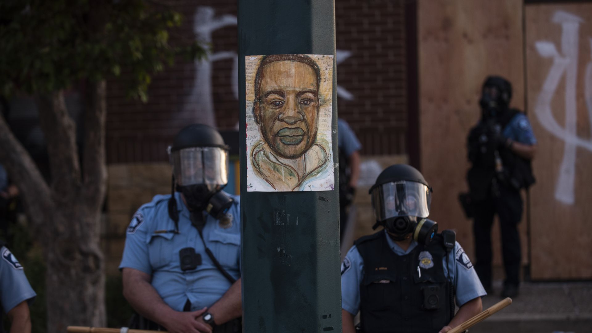 A portrait of George Floyd hangs on a street light pole in Minneapolis.