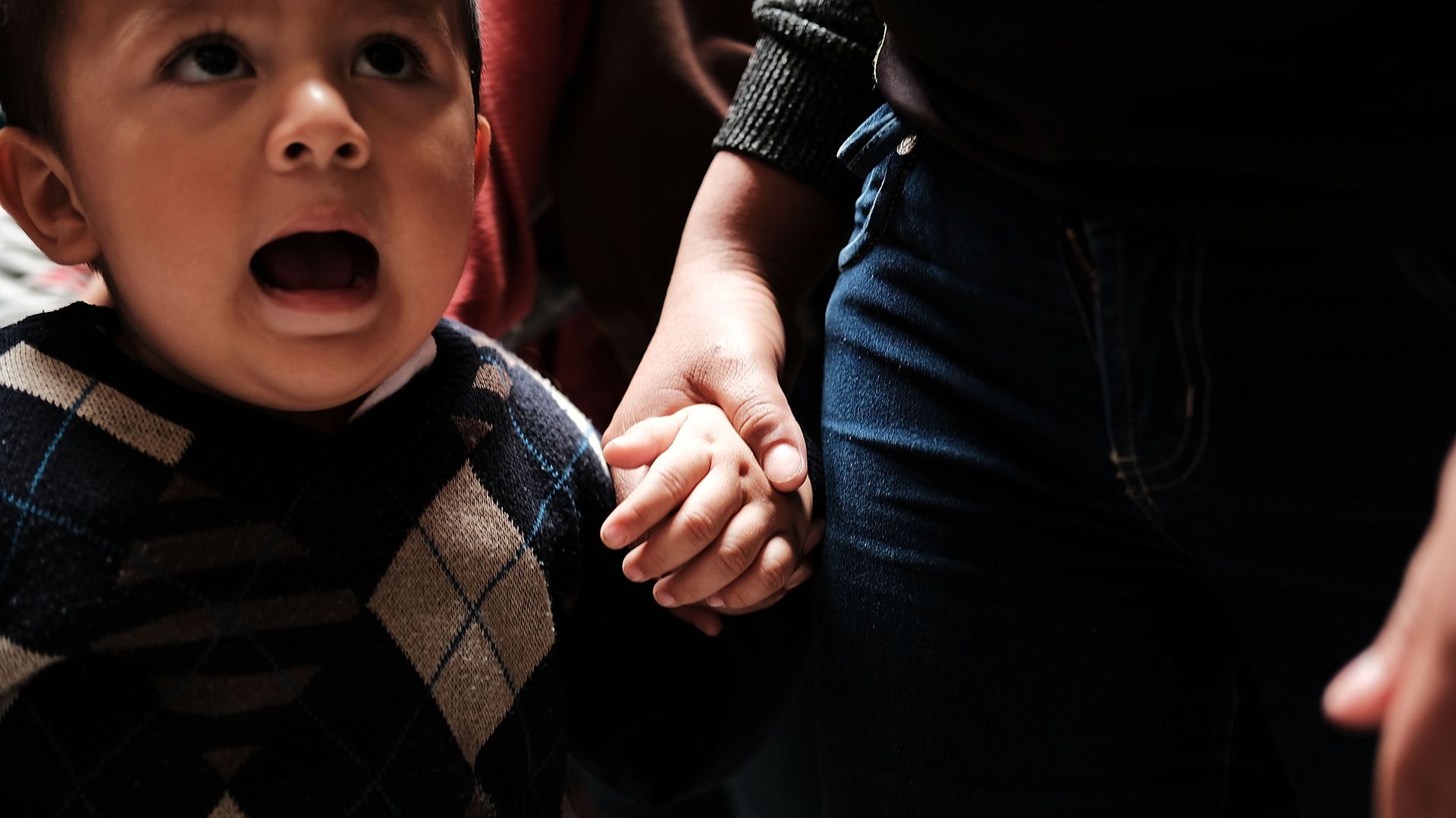 An immigrant child with his mother. 