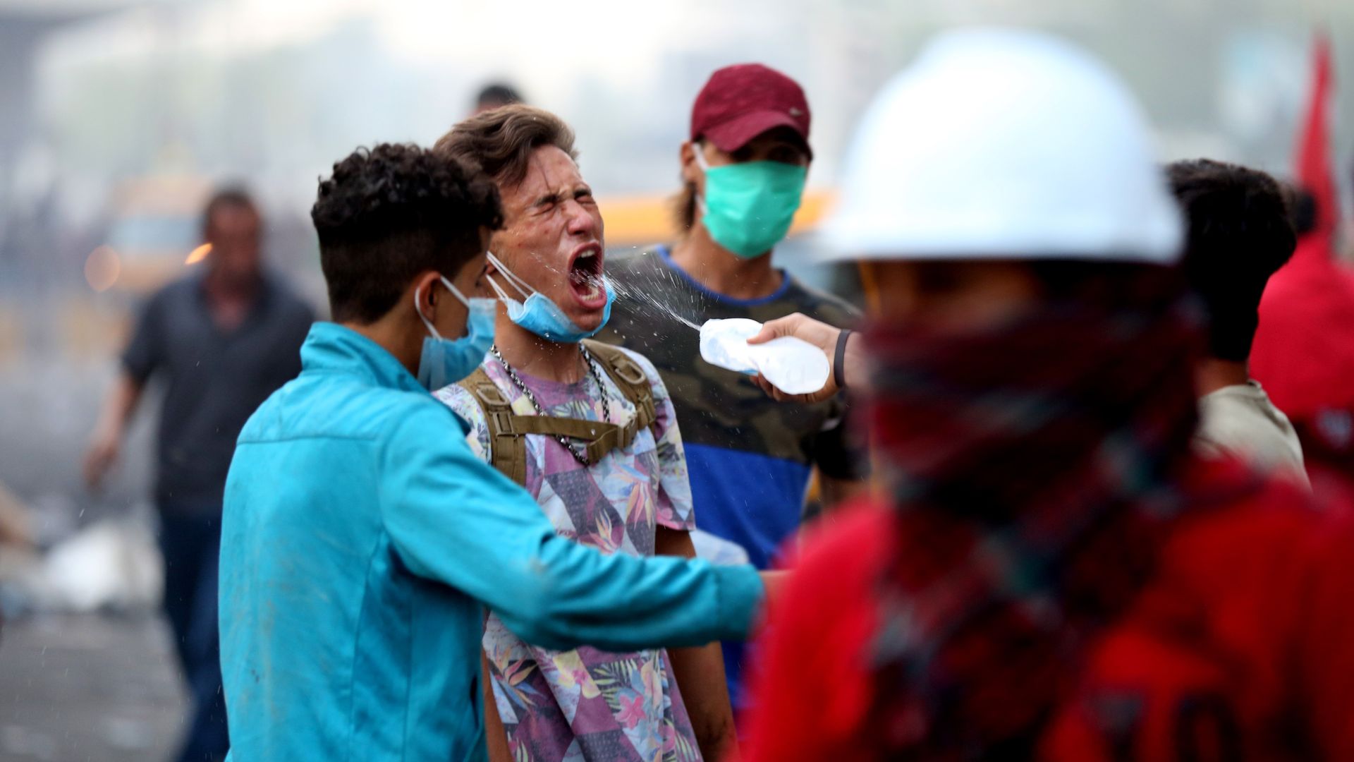 A demonstrator, wounded after security forces' intervention with gas bomb, is seen, during the ongoing anti-government demonstrations in Iraq's capital Baghdad