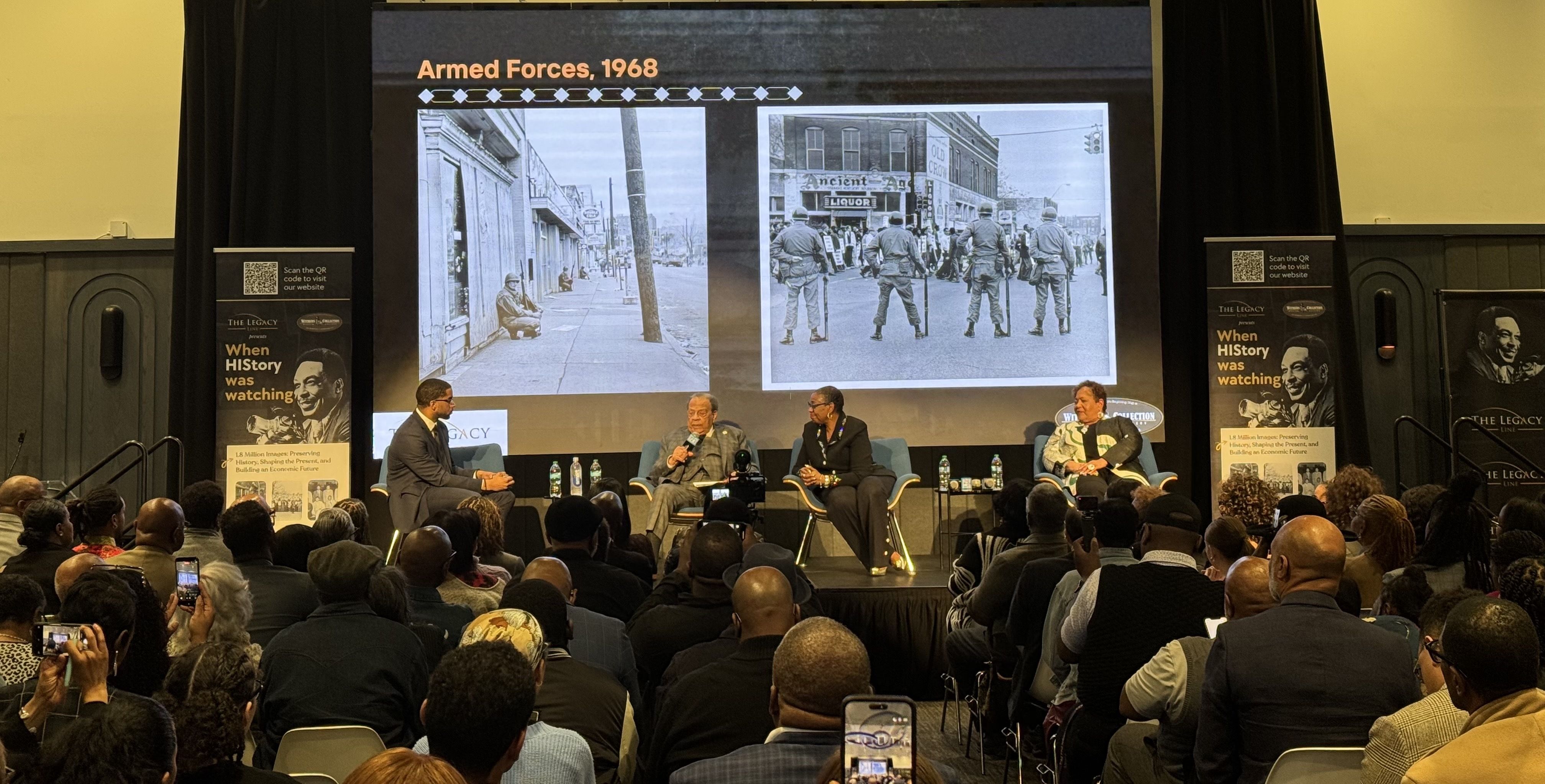 Ambassador Andrew Young speaks during “When HIStory Was Watching” at The Gathering Spot in Atlanta on Feb. 17, as a 1968 photograph by civil rights photographer Ernest C. Withers is projected behind him.