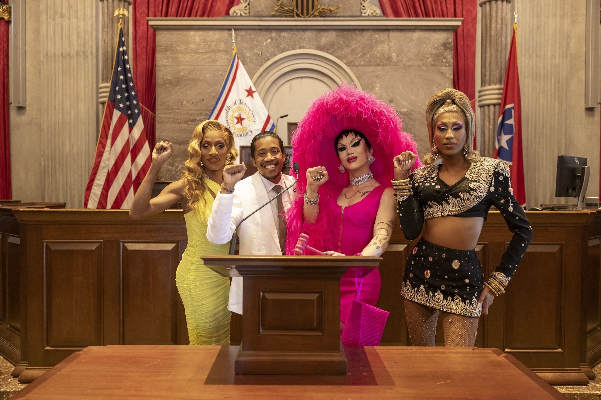 Drag queens pose with Rep. Justin Jones in the Tennessee House chamber.