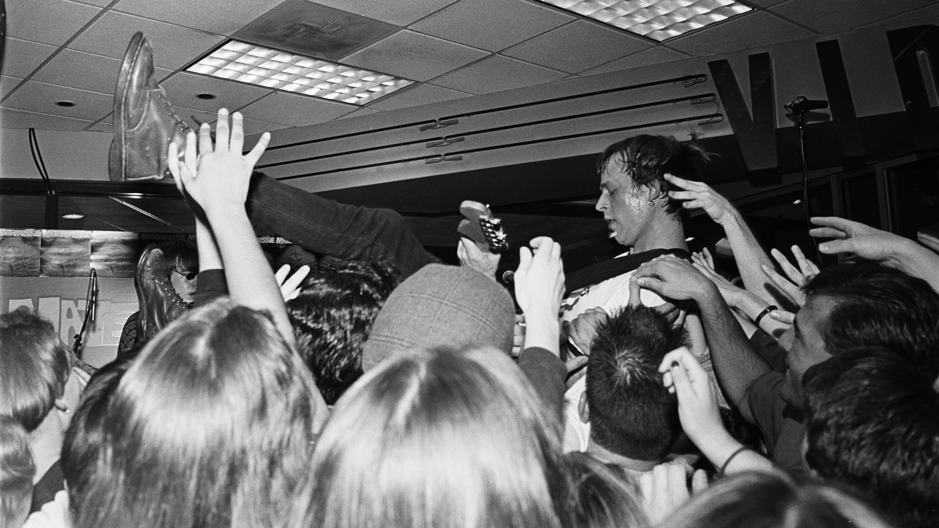 Guy crowd surfing.