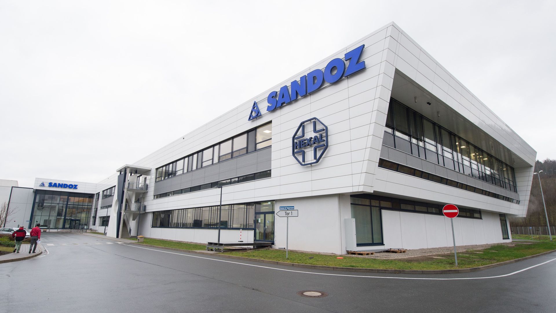 A white building with the blue Sandoz logo on the front.