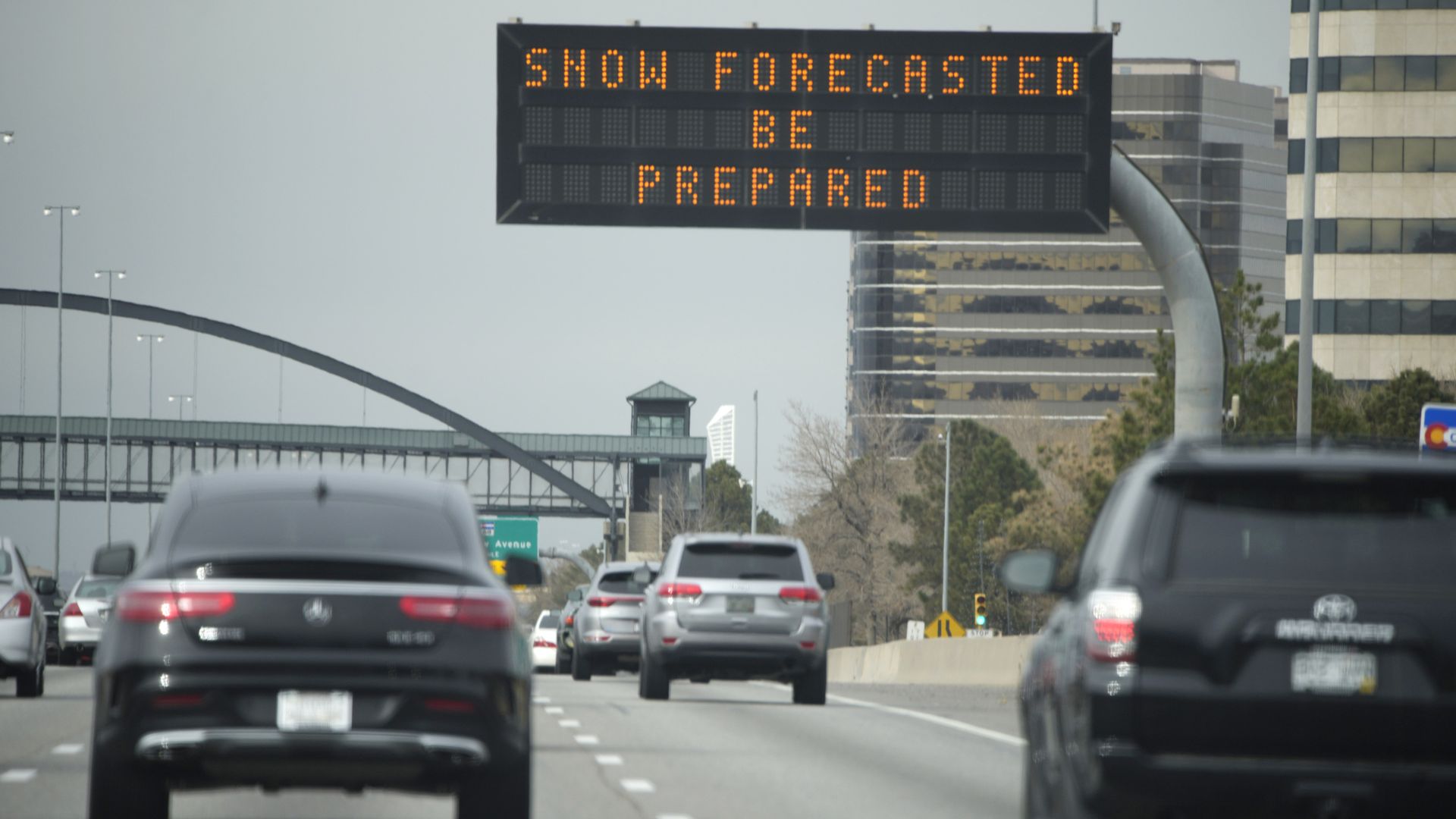 An overhead sign advises motorists to take caution on Interstate 25 in Greenwood Village. Photo:David Zalubowski/AP