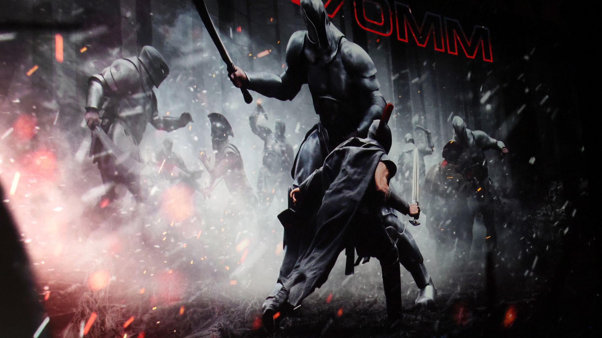 A Greek soldier with a plumed helmet fights against a much larger opponent in a still from "The Odyssey." Sparks are flying.