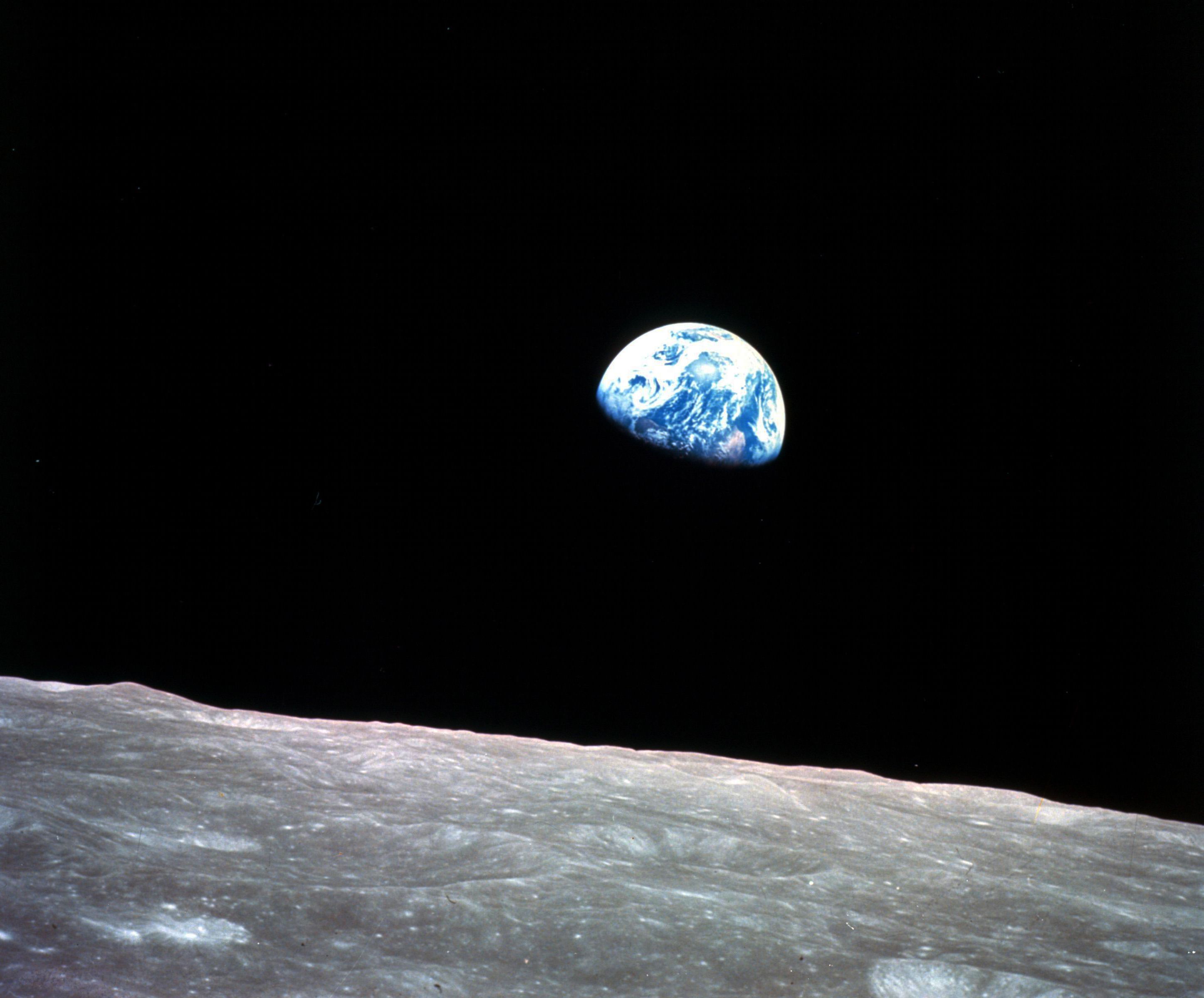 This Dec. 24, 1968, file photo made available by NASA shows the Earth behind the surface of the moon during the Apollo 8 mission. Retired Maj. Gen. William Anders, the former Apollo 8 astronaut who took the iconic “Earthrise” photo