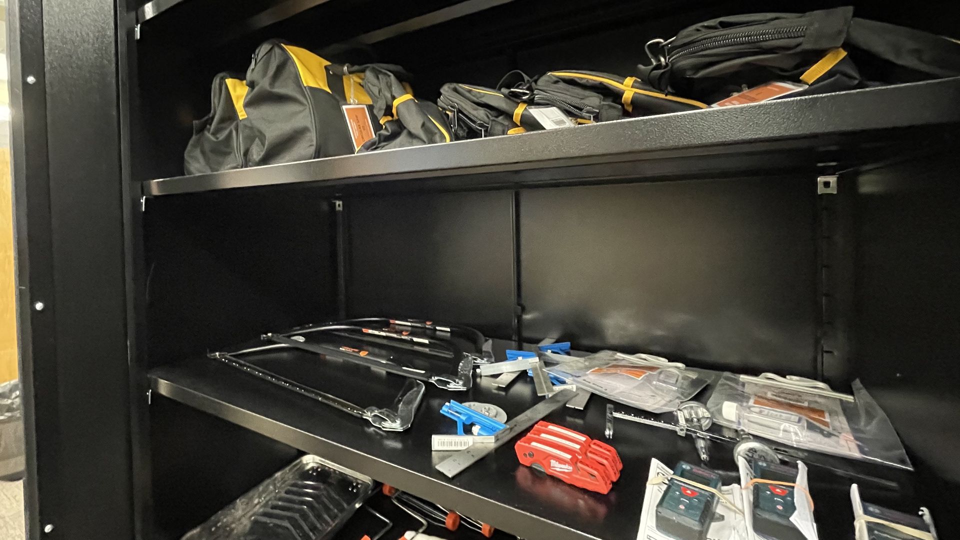 Rows of tools sit on the shelves in a cabinet at the Public Library of Brookline in Coolidge Corner.
