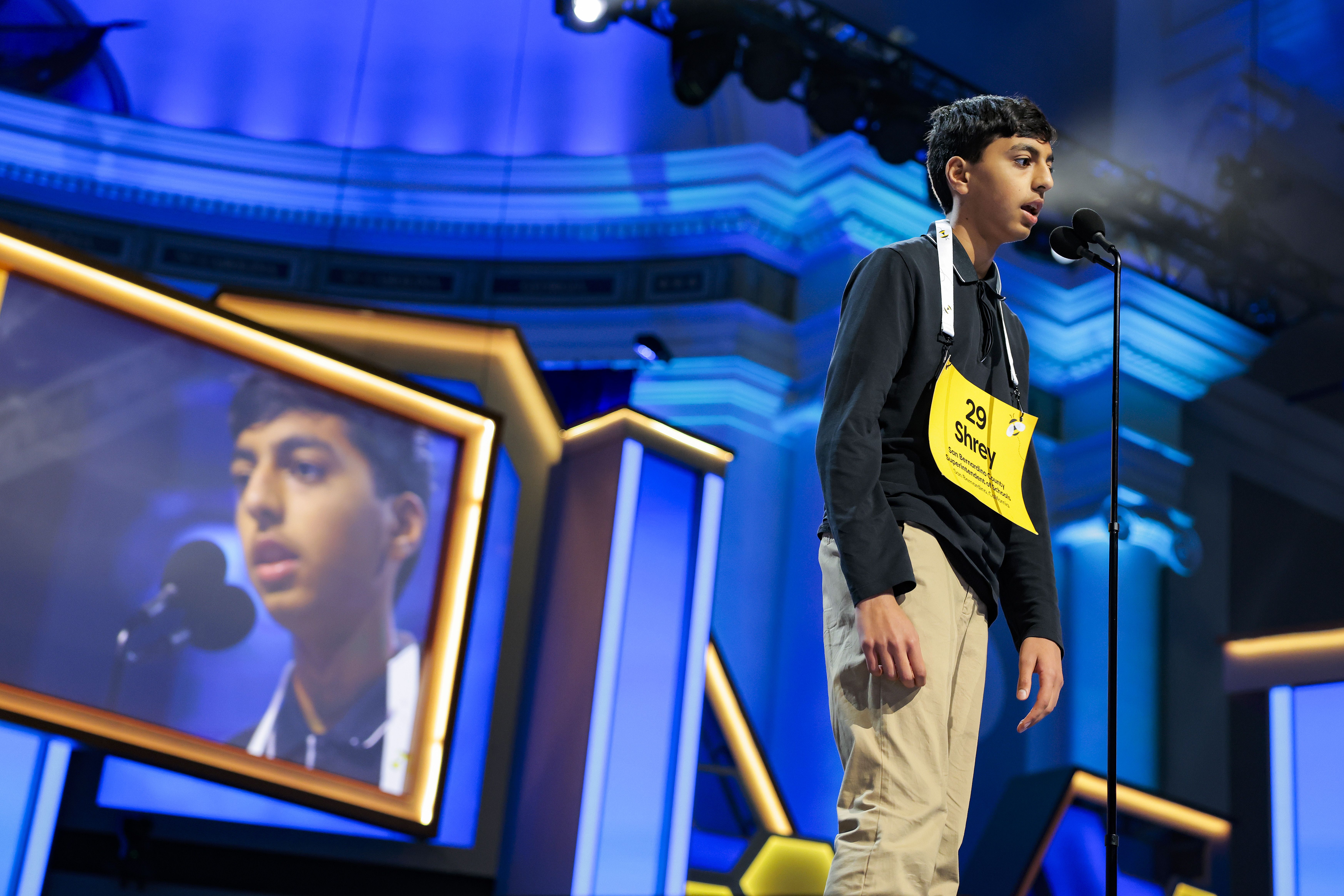 Shrey Parikh correctly spells a word on stage at the Scripps National Spelling Bee at Constitution Hall in Washington DC.