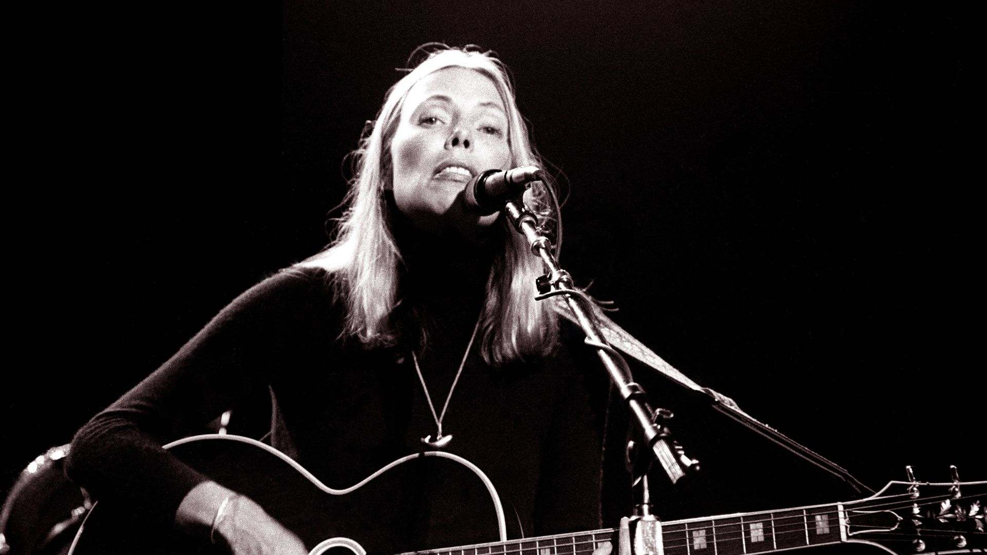 Joni Mitchell performing at "California Celebrates the Whales" at the Memorial Auditorium in Sacramento, California on November 20. 1976. 