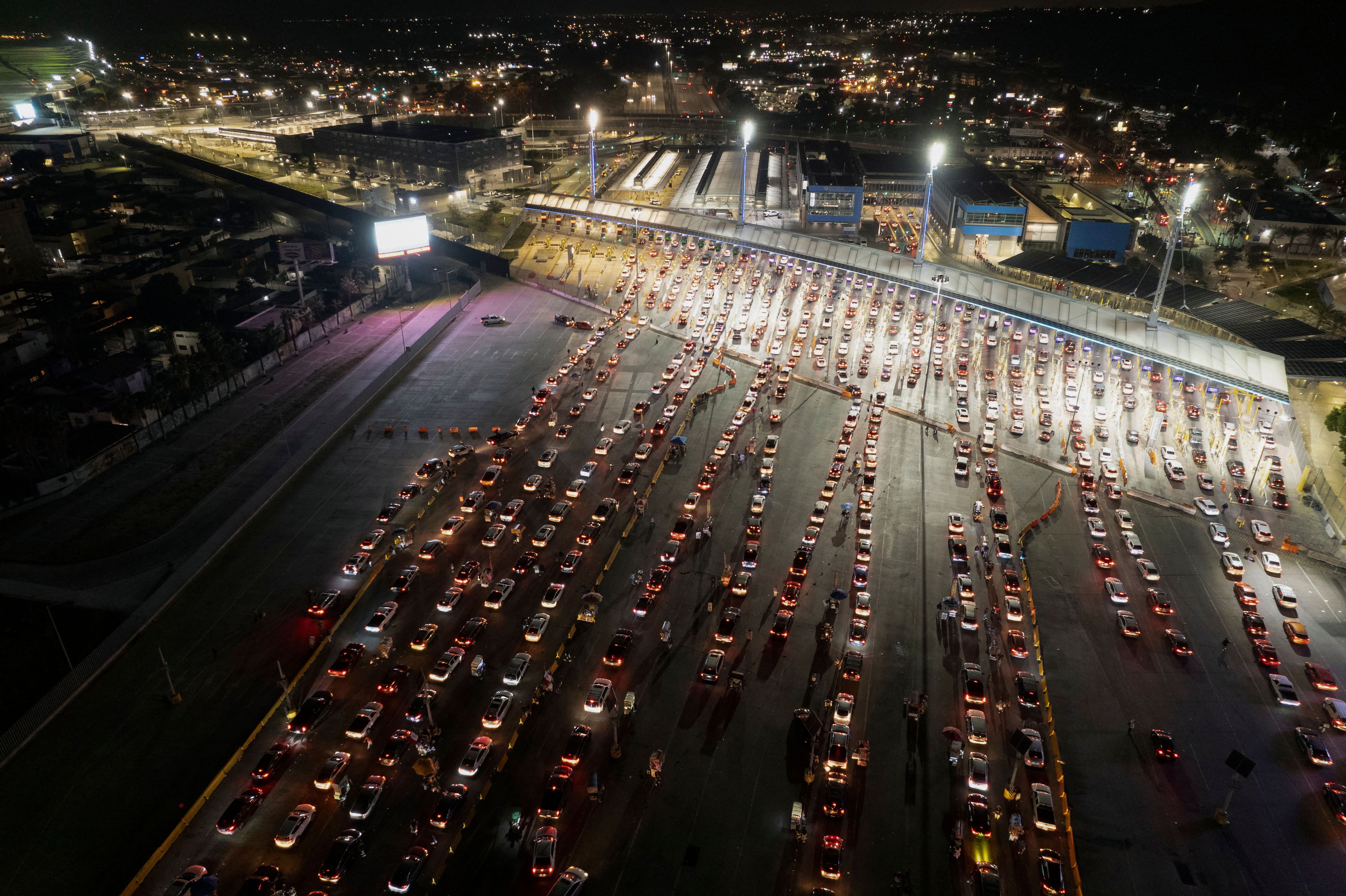  An aerial view of cars lining-up to cross the border at San Ysidro crossing port on the Mexico-United States border in Tijuana, Baja California state, Mexico, on November 7