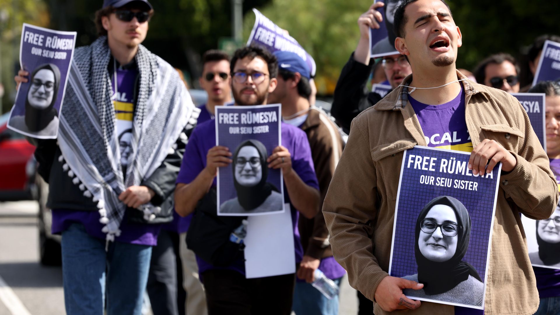 SEIU members protest the detainment of Rumeysa Ozturk, holding signs saying "Free Rumeysa, our SEIU sister" in April 2025.