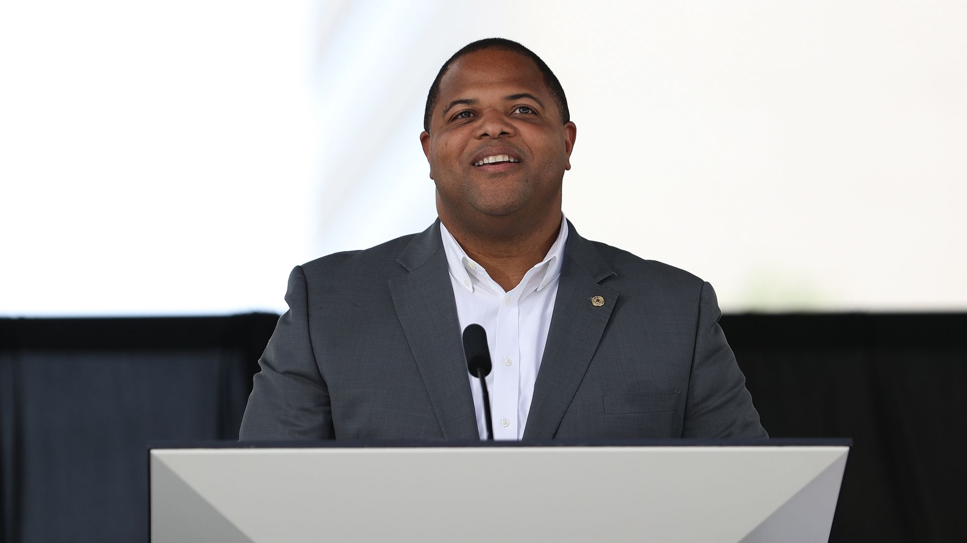 Dallas Mayor Eric Johnson, looking out from a podium with child-like wonder.