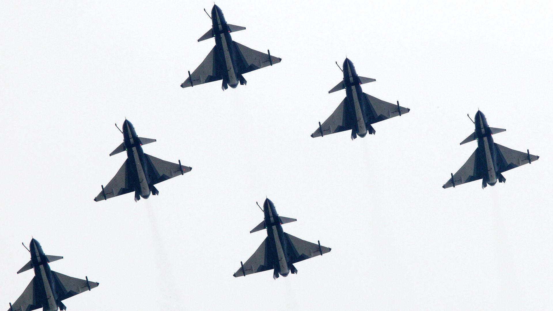 China's J-10 fighter jets perform during a flight demonstration at the 9th China International Aviation & Aerospace Exhibition in the southern Chinese city of Zhuhai.