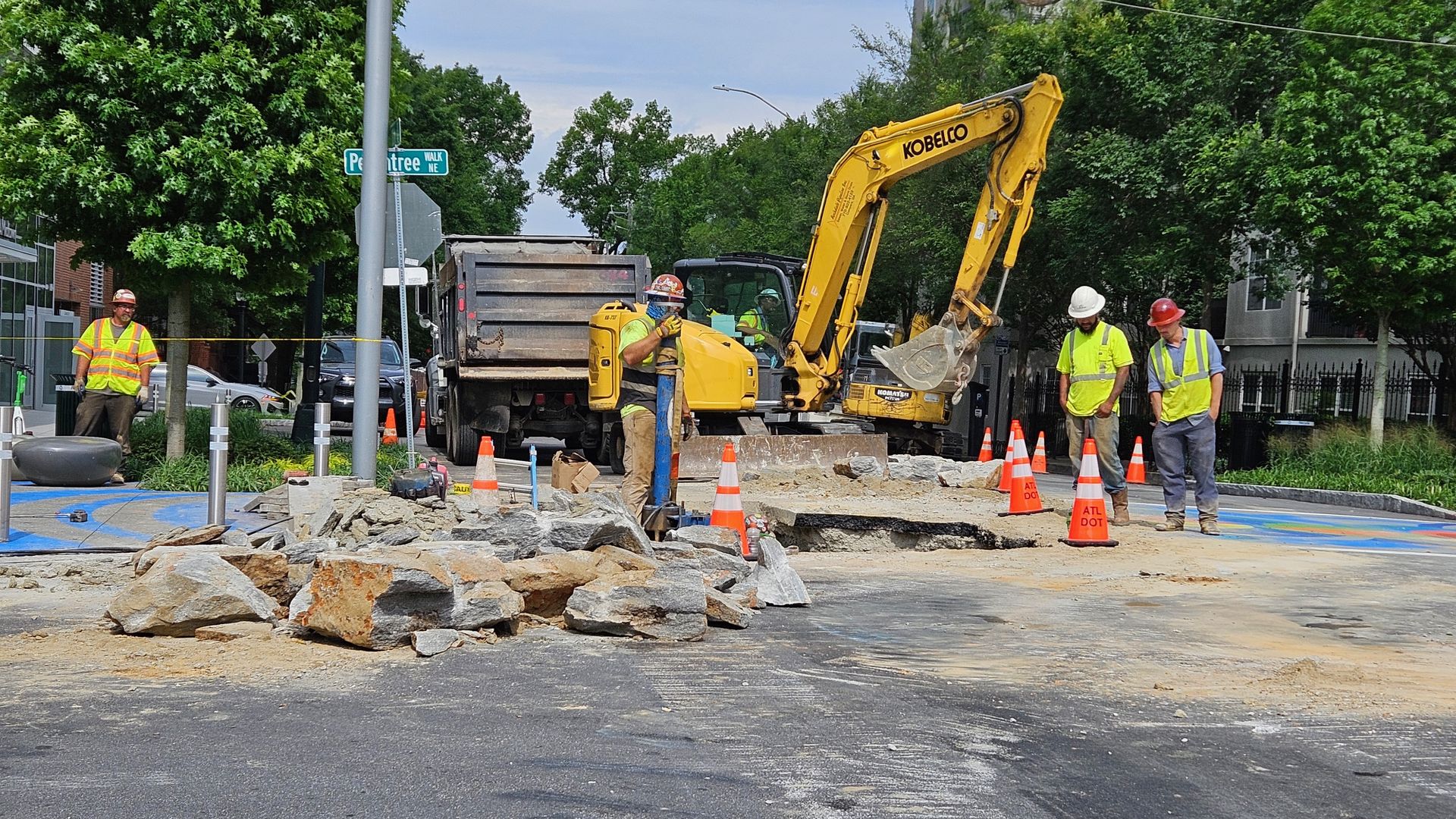 Atlanta watershed crews work to repair a water main break at 11th Street and Peachtree Walk. 