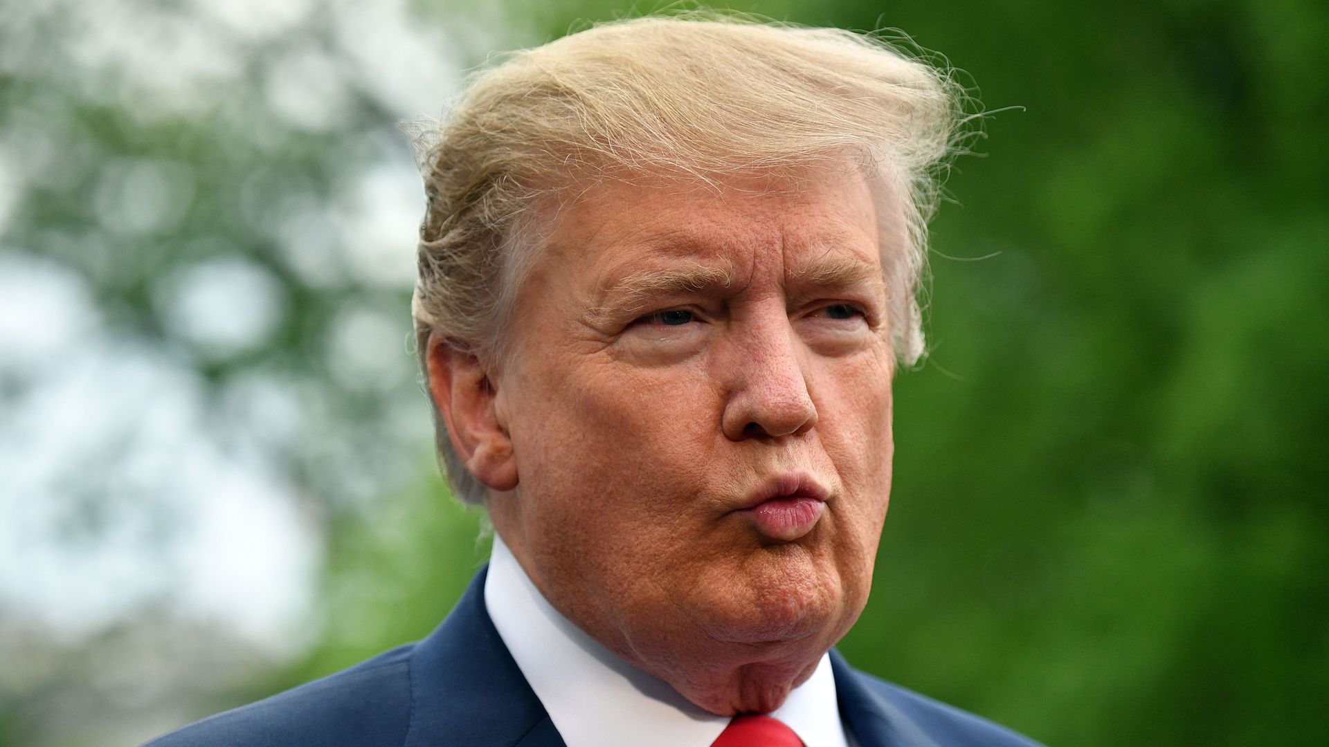 US President Donald Trump speaks to reporters before boarding Marine One from the South Lawn of the White House in Washington, DC on April 26, 2019.