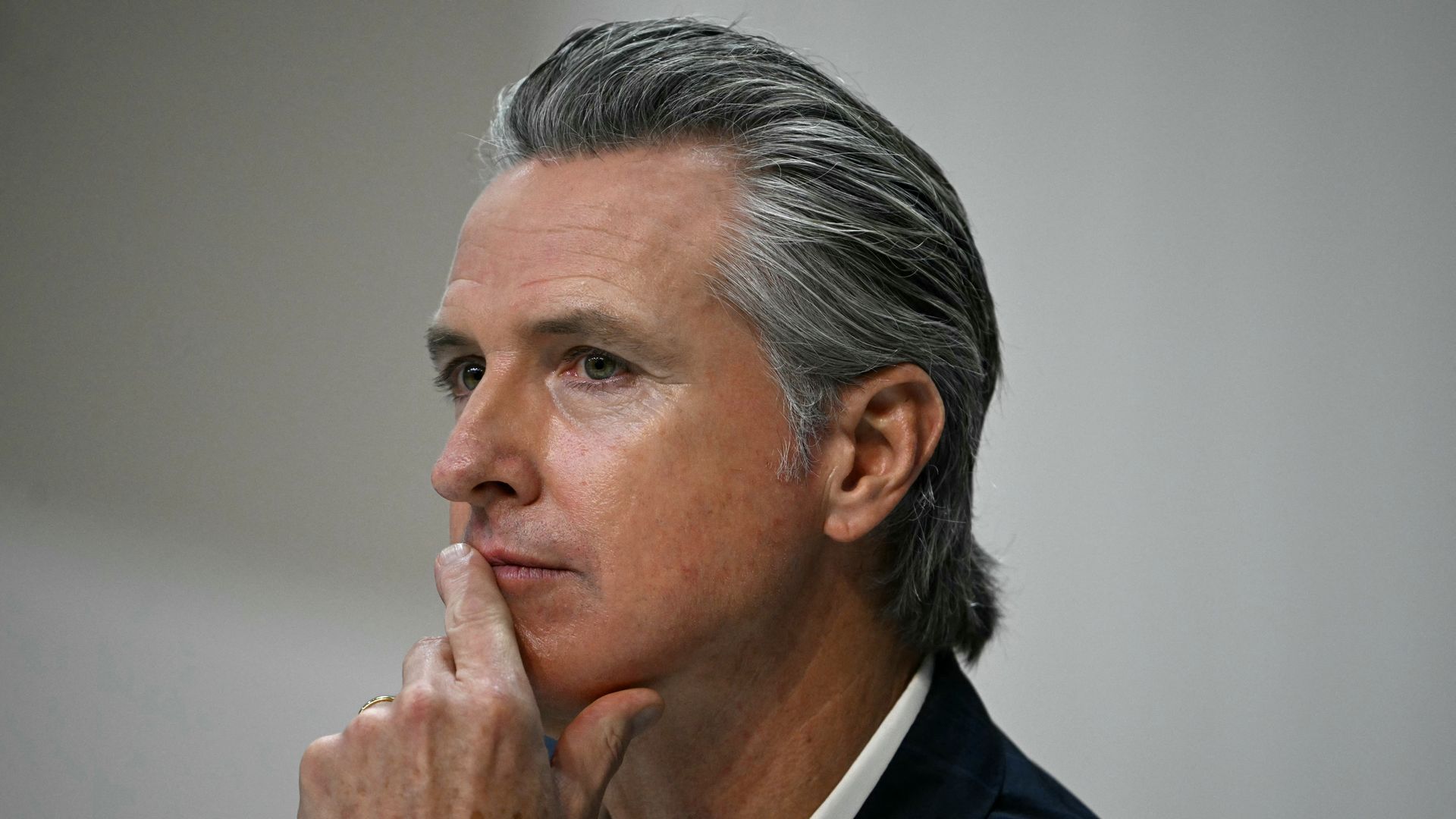 Gavin News looks to his right.