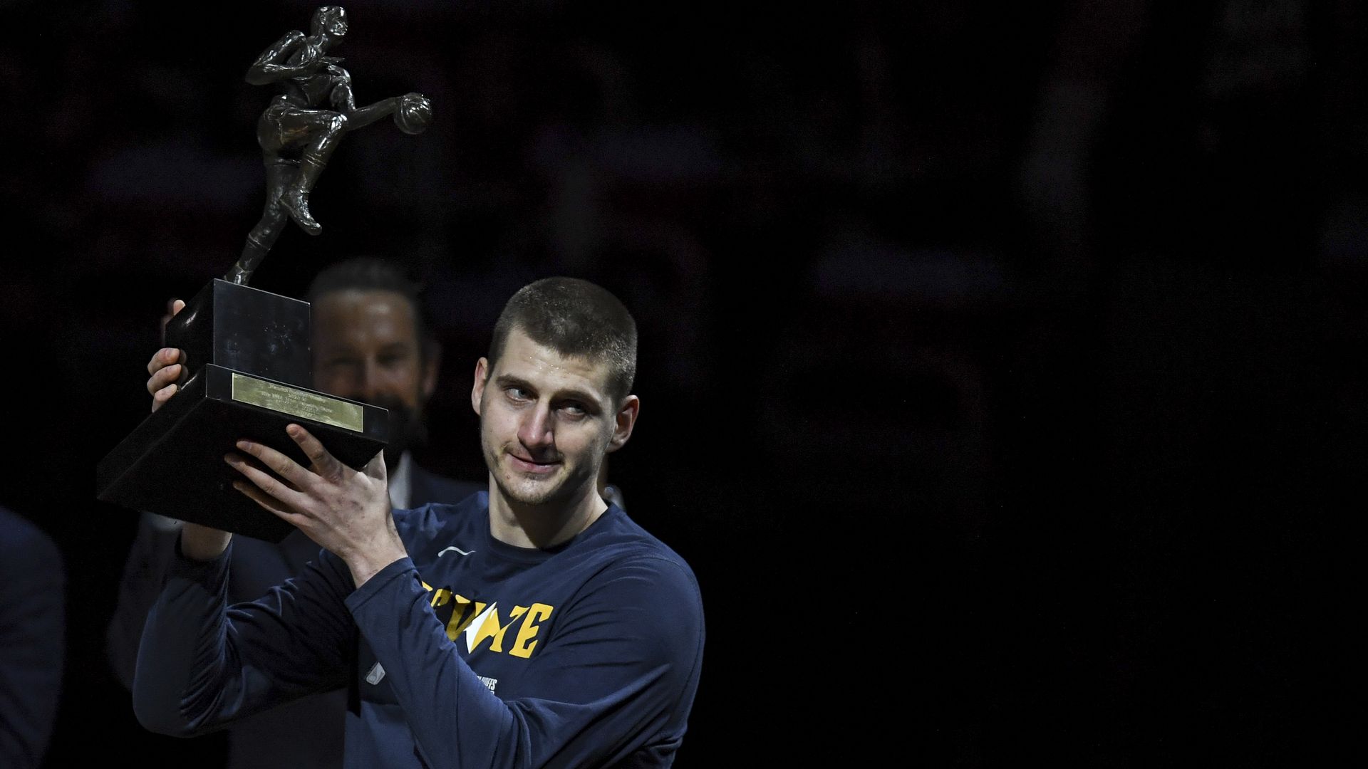 Nikola Jokic of the Denver Nuggets hoists his MVP trophy in June.