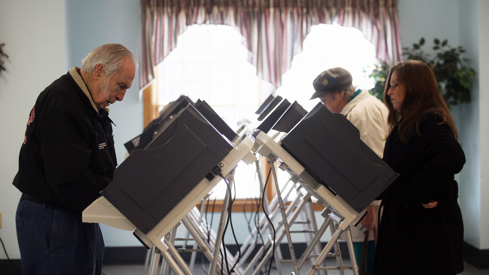 Voters cast their ballots at a polling place during Super Tuesday voting on March 6, 2012 in Carrollton, Ohio. 