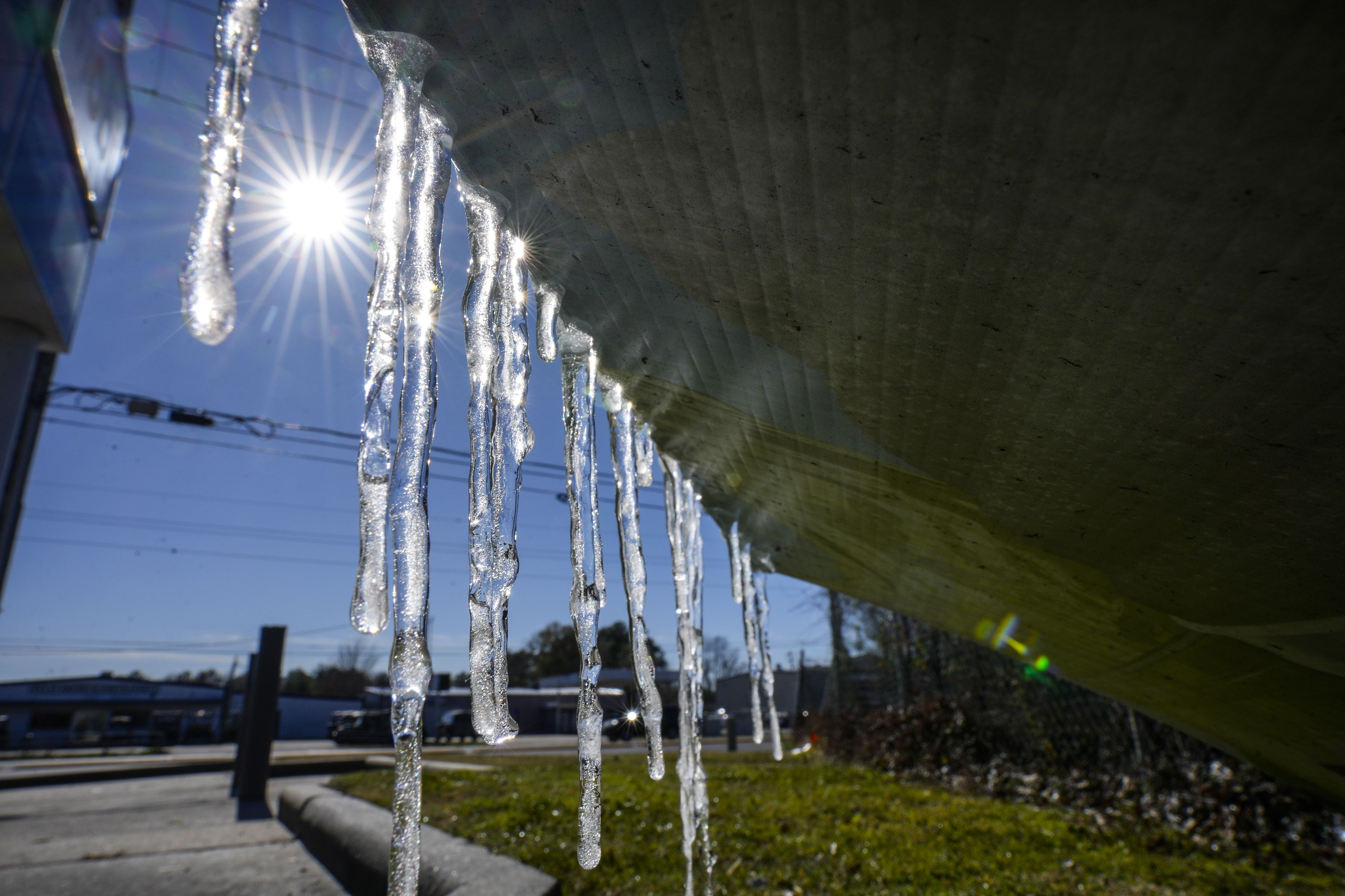 : Icicles are formed on a sign at a convenience store along FM2920 on Tuesday, Jan. 16, 2024 in Spring.