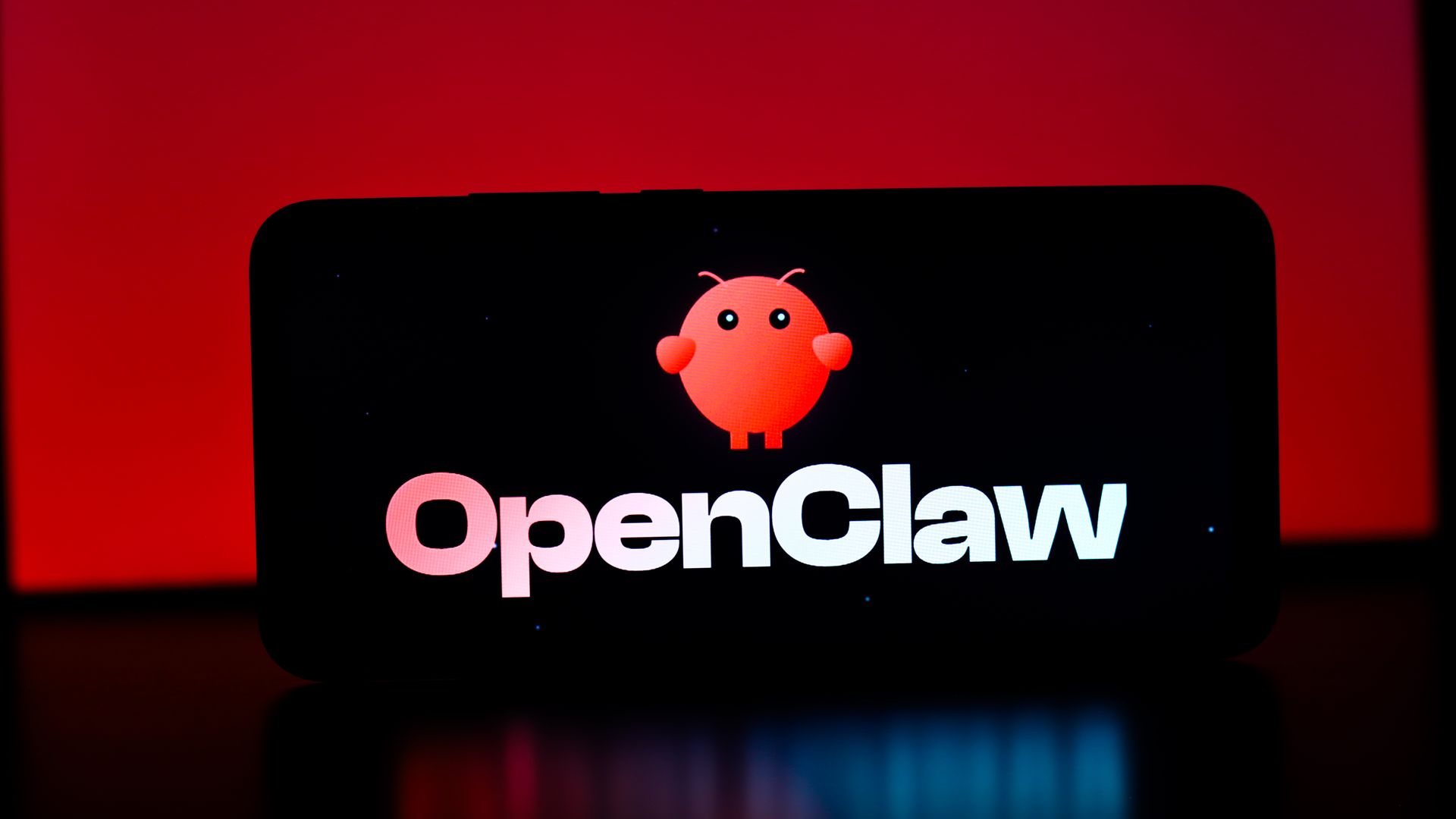 The OpenClaw logo is displayed on a smartphone screen in this photo illustration