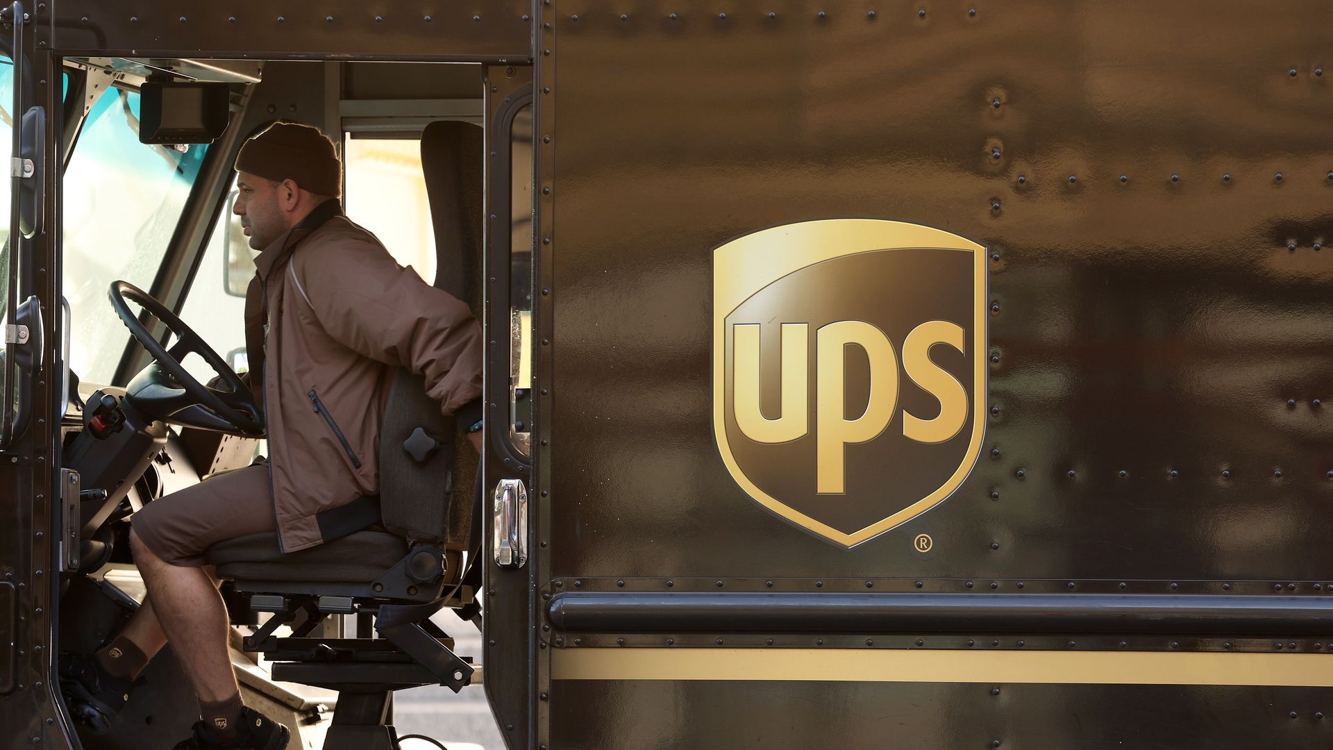 Photo of a UPS driver in his truck