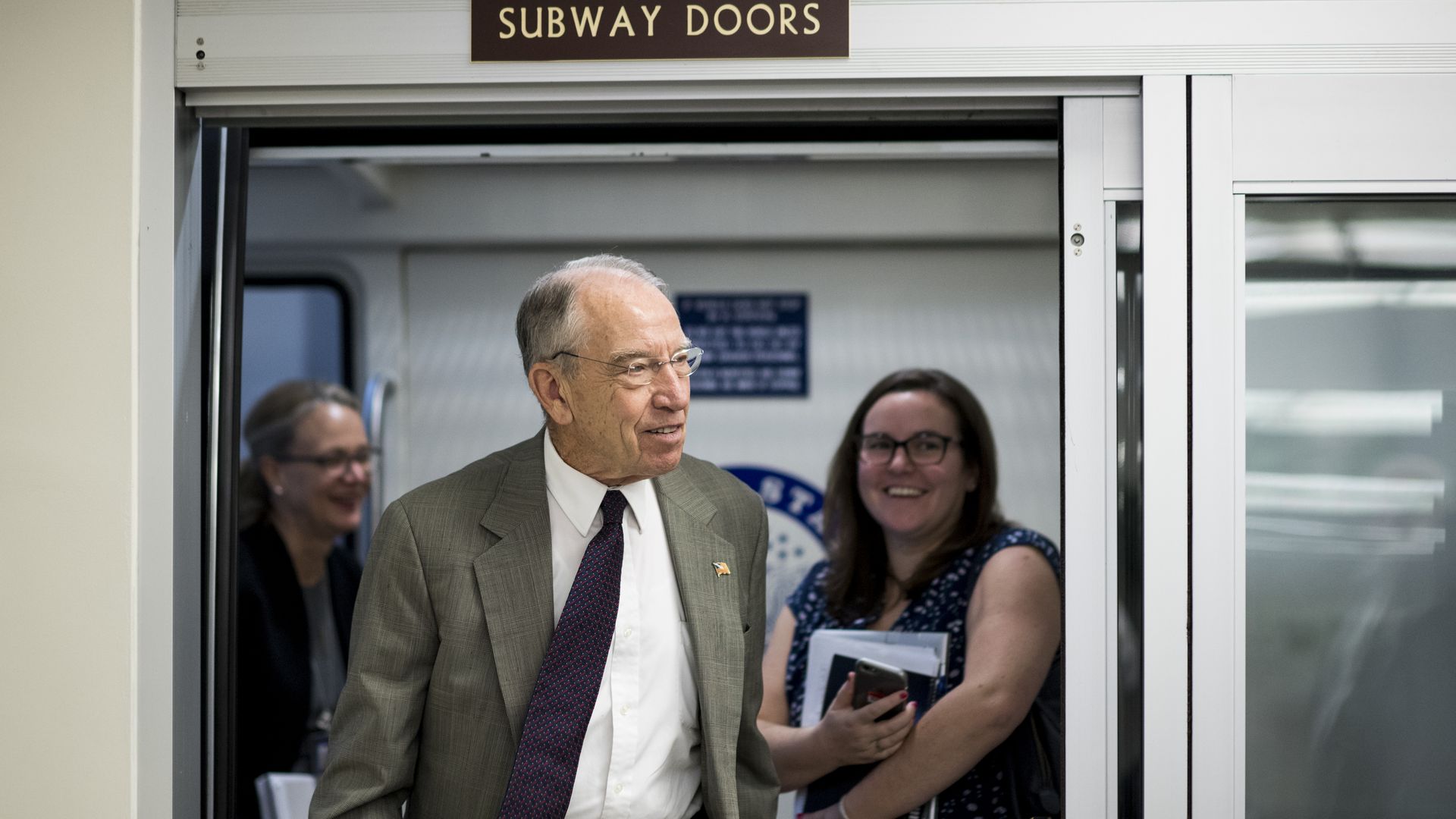 Sen. Chuck Grassley stepping off the Senate subway.