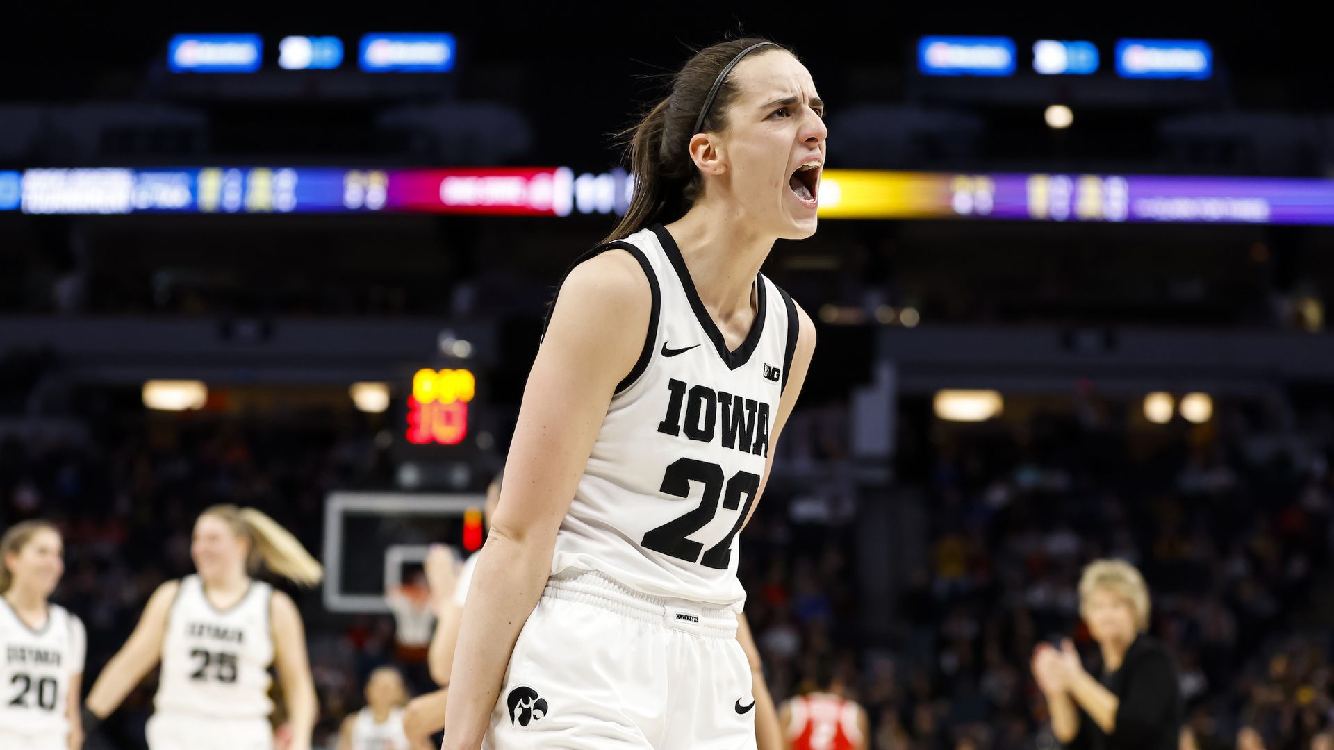 Iowa women's basketball player Caitlin Clark screams to the crowd. 