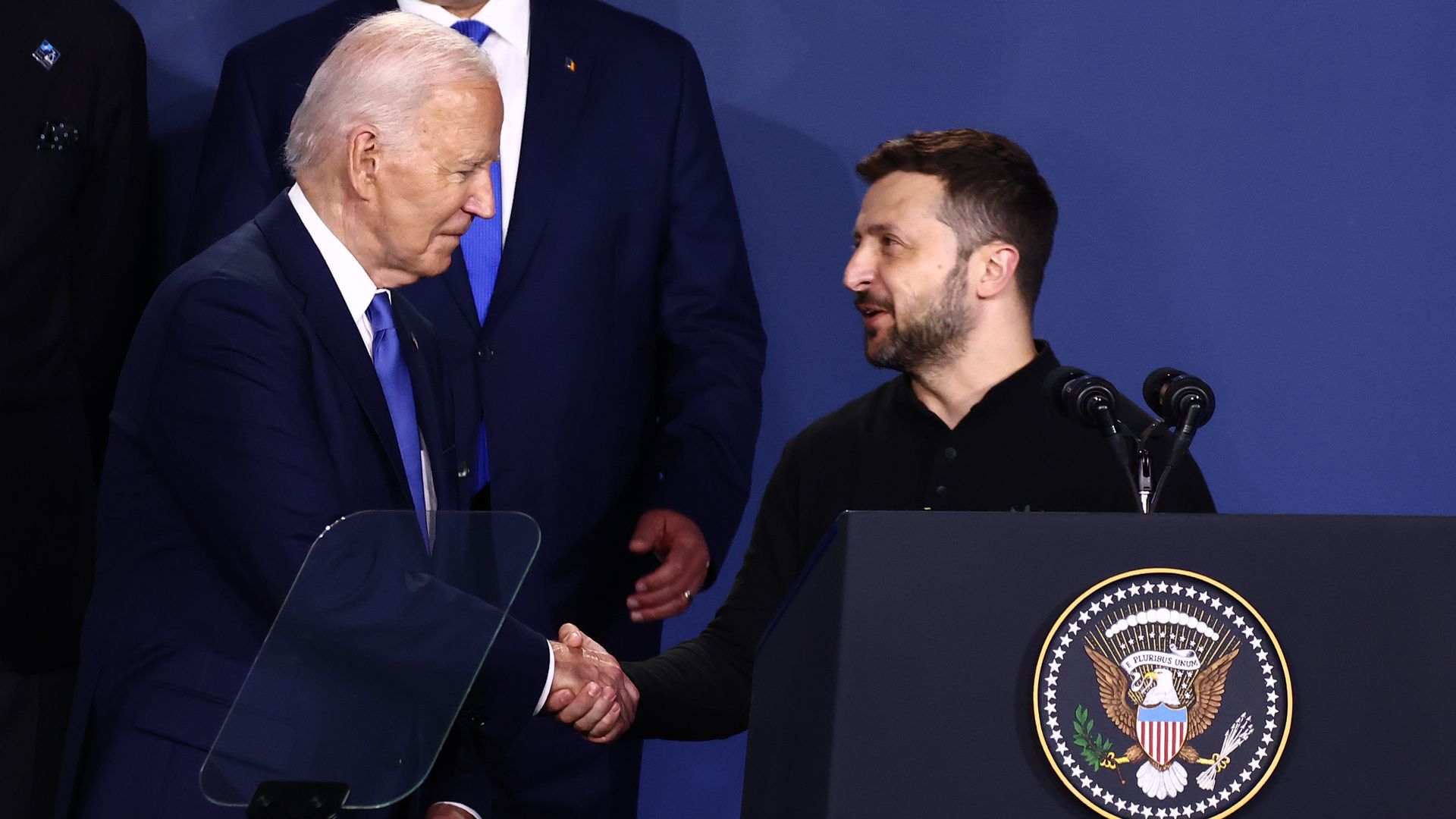 President Joe Biden and Ukraine President Volodymyr Zelenskyy shake hands at the Ukraine Compact meeting during the 75th NATO Summit in the Walter E. Washington Convention Center in Washington, DC, on July 11, 2024. 